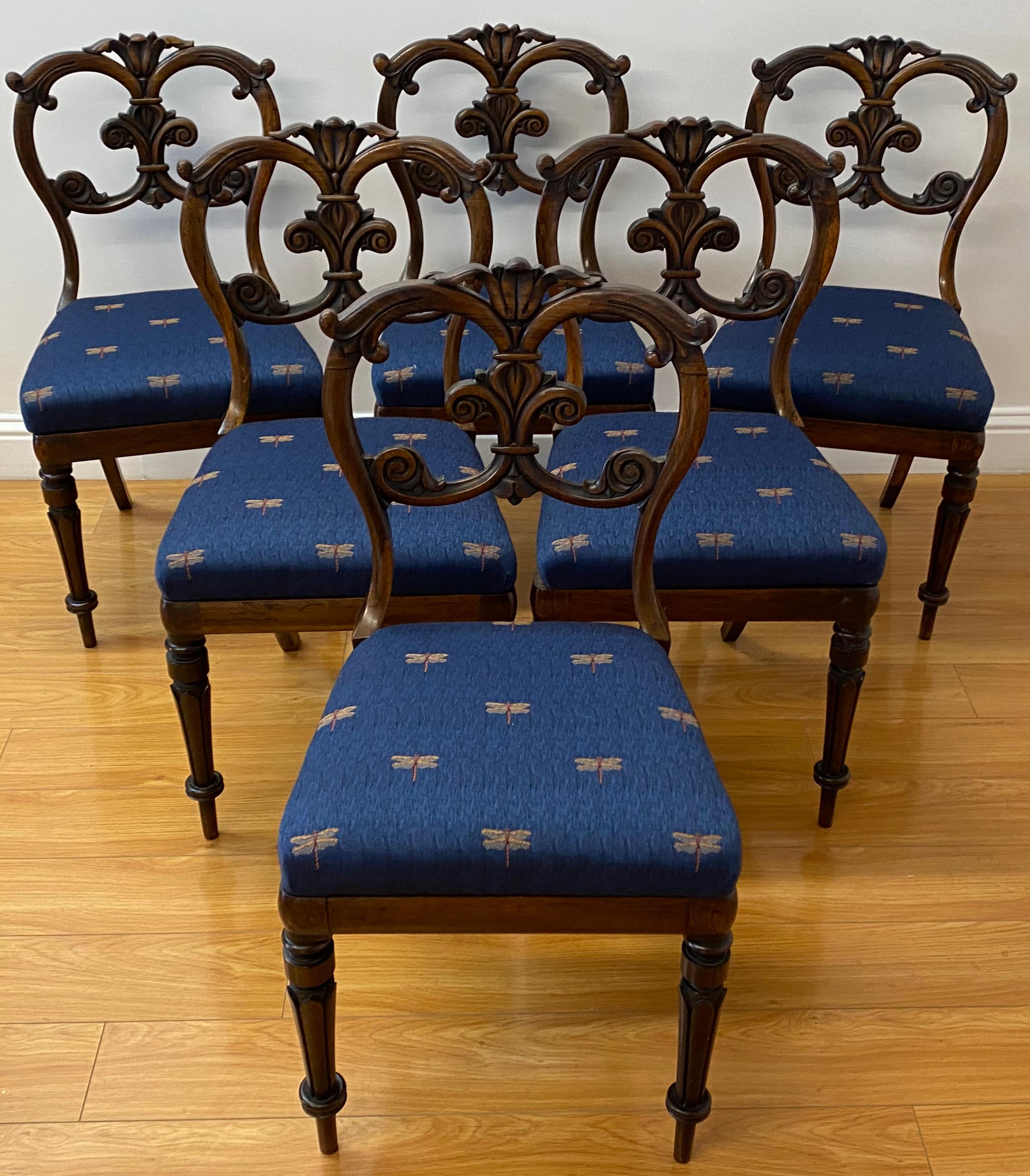 Set of six English carved rosewood dining chairs, c.1850

Gorgeous mid 19th century hand carved dining chairs with drop in seats

The current seat coverings have a handsome dragonfly pattern (easily reupholstered)

18