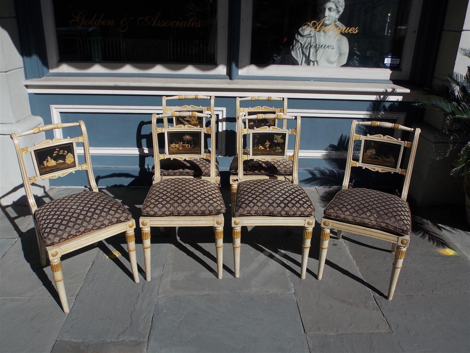 Set of Six English Regency chinoiserie painted and gilt side chairs with floral gilt medallions, cane seats with silk upholstered cushions, and resting on the original splayed  legs. Early 19th century.