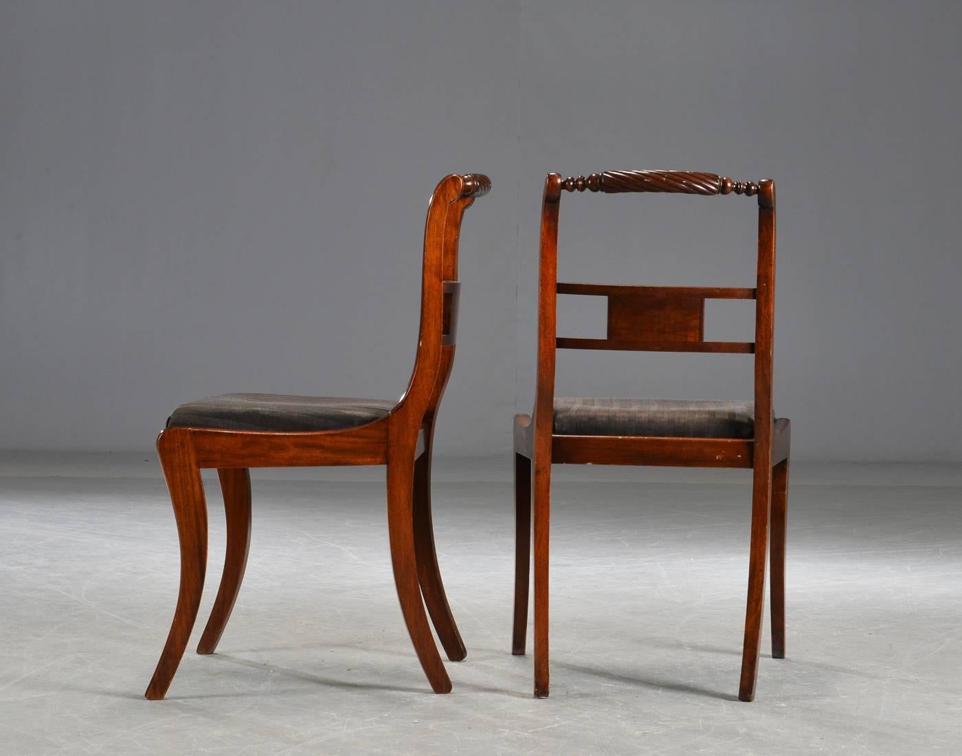 Solid mahogany, Regency style dining chairs. The seat of striped black fabric. 
Dimensions: Height 85 cm, wide 50 cm, Sh 46 cm. 
Very good original condition.