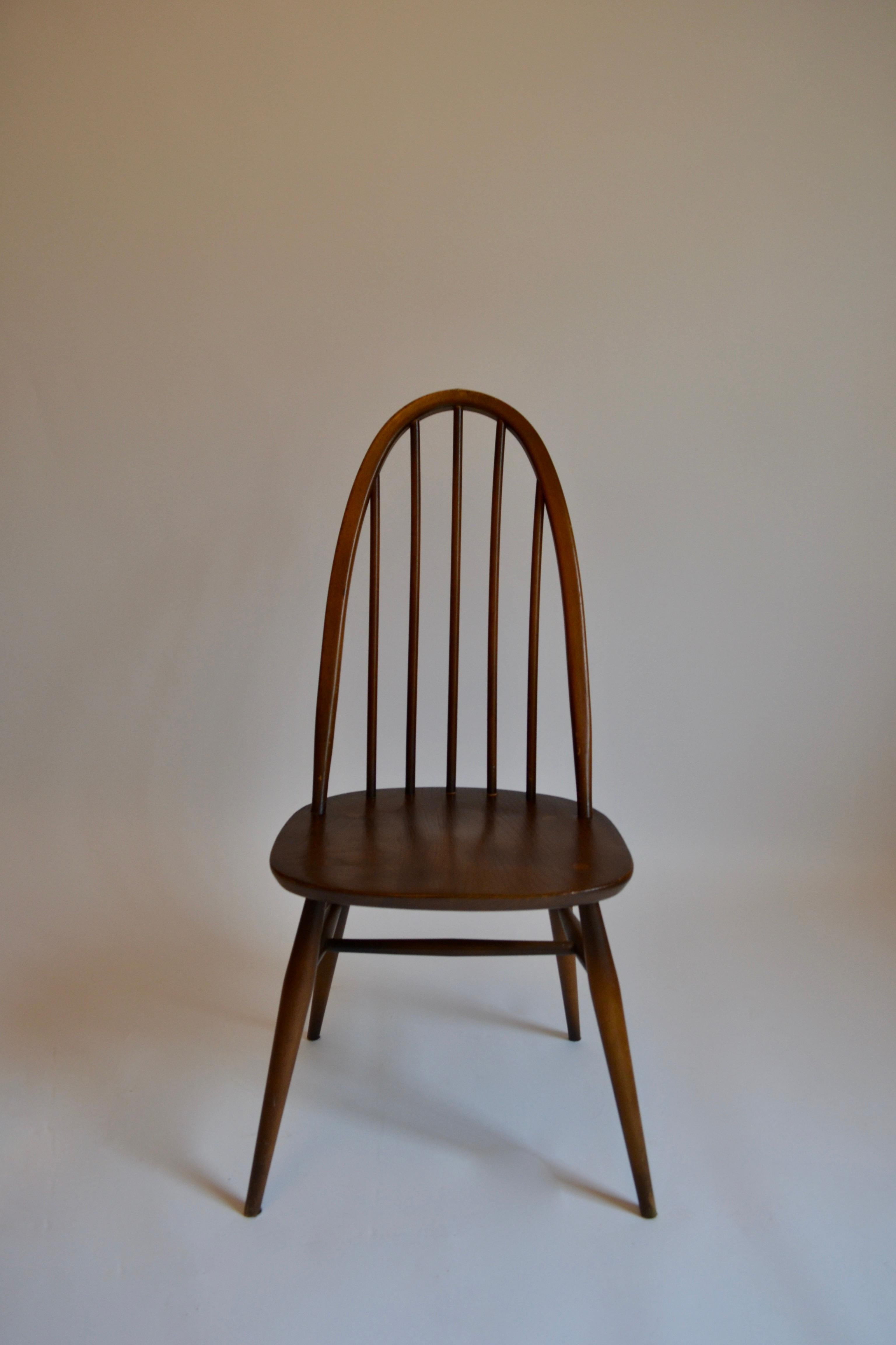 Set of Six Ercol Quaker hoop back dining chairs crafted from elm wood, from the 1960s. Each chair is in solid and stable condition but in varying cosmetic condition and with varying patinas as documented. Defects include scratches and scuffs. Could
