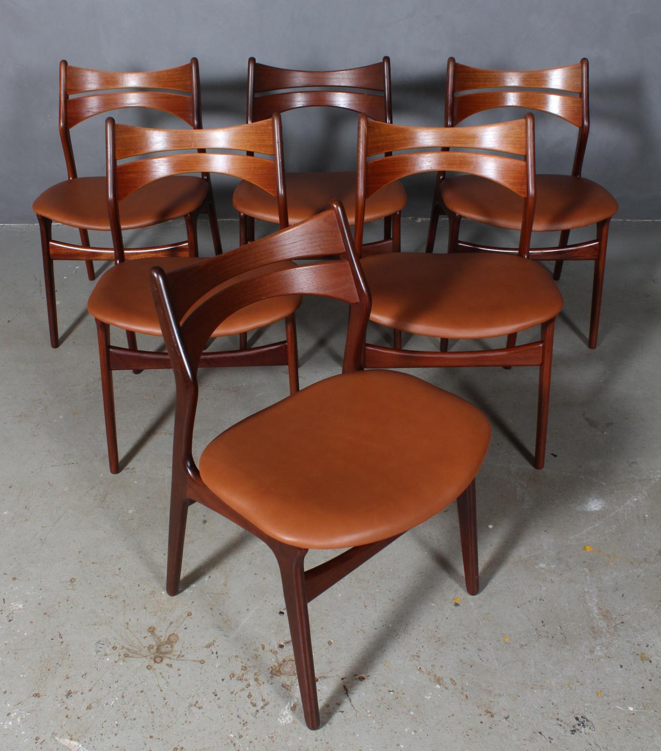 Six Eric Buch chairs with frame of partly solid teak.

New upholstered with tan aniline leather. 

Model 310, made by Chr Christensens Møbelfabrik, Denmark.