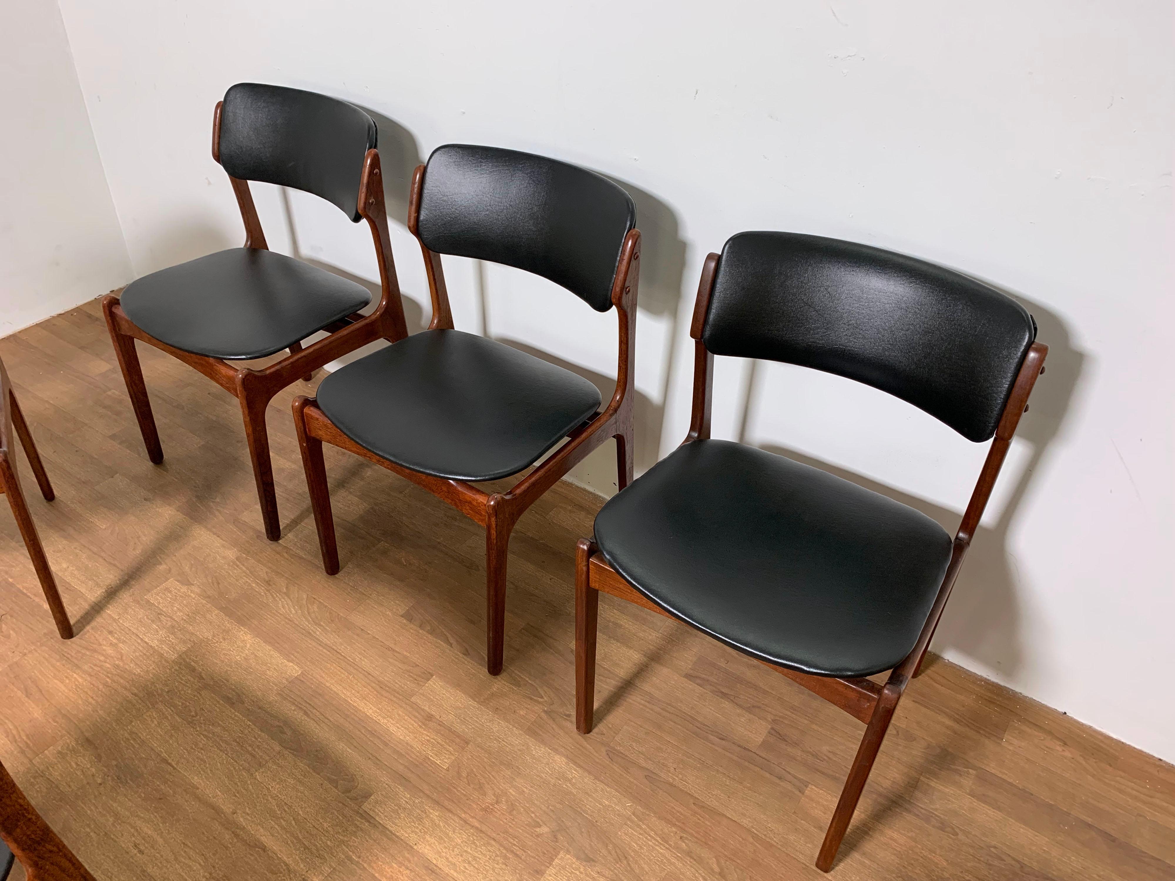 Set of six teak dining chairs by Erik Buch, for Odense Mobelfabrik, made in Denmark circa 1960s. 

Note that the prior owner apparently acquired two chairs to add to a set of four. These are all original model 49 dining chairs, but based on their