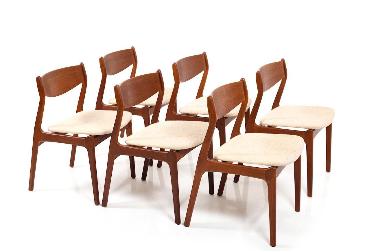 Set of six Erik Buch dining chairs in teak. Nice conical form with curved backrest. Seats with fabric. Designed and produced of early 1960s.