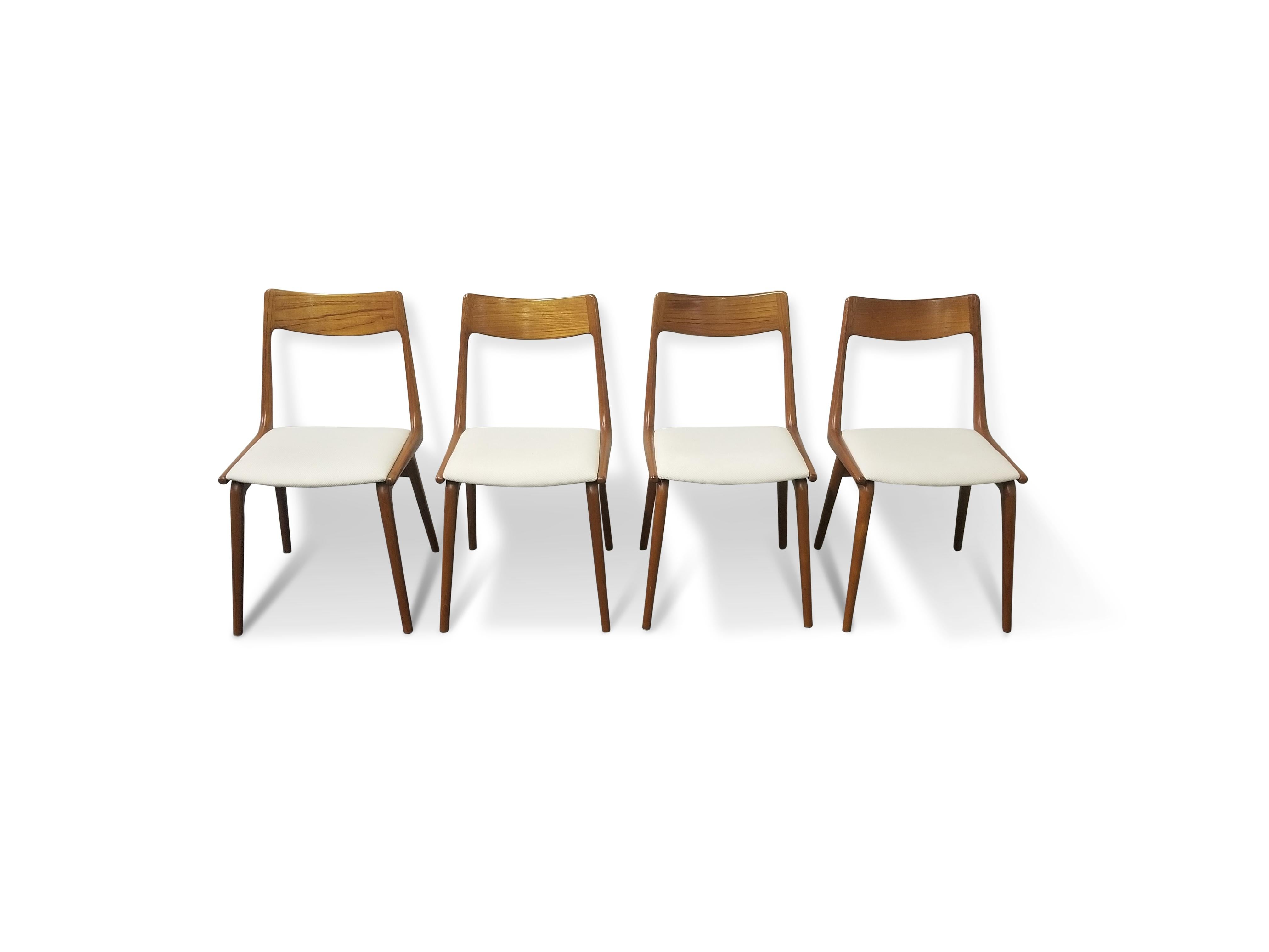 Set of six Erik Christiansen ‘Boomerang’ teak dining chairs 

Captain chairs:
22” D x 21.5” W x 31.5 H 
18.25 seat height.