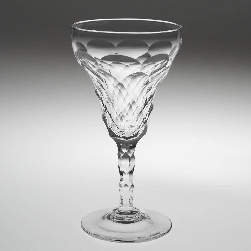 Heading : Set of six early 20th century facet cut white wine glasses
Period : Early 20th century c1930
Origin : England 
Colour : Clear and bright 
Bowl : Diamond facet and scale cut
Stem : Elongated hexagonal facet
Foot : Conical 
Pontil : Polished