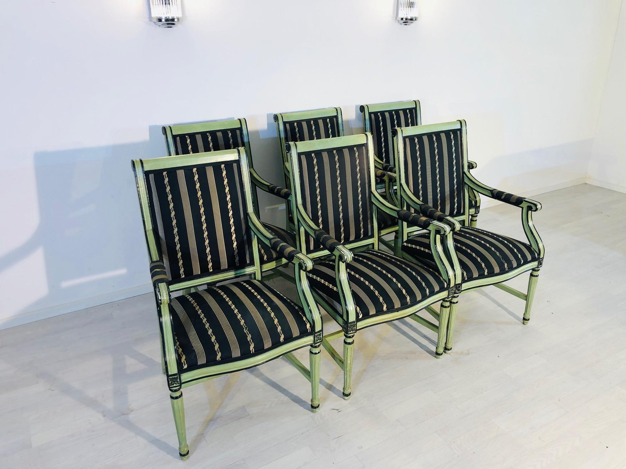Beautiful set of six farmhouse style armchairs with a wonderful mint-green finish. These mid-century pieces from the 1960s convince with their unique and Classic farmhouse design with fluted legs and curved armrests with finely crafted details. They