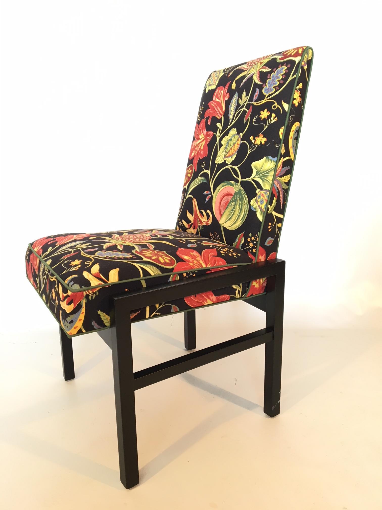 Set of 6 Directional dining chairs with black wood frames upholstered in a vibrant floral print on a black background. Very good condition with very minor signs of age appropriate wear. Fabric in near perfect condition.