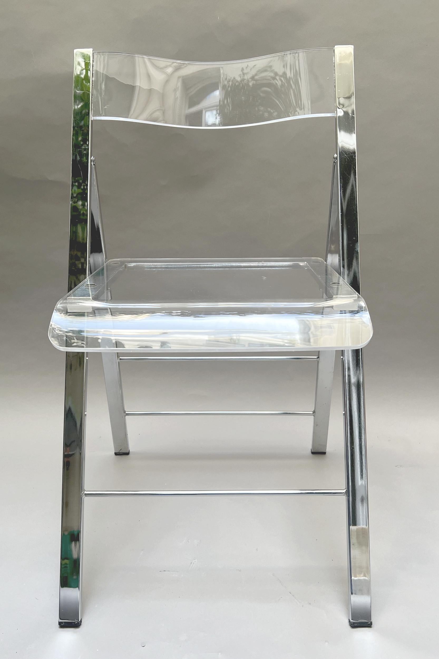

Set of six folding chairs in thermoformed plexiglass and chromed metal.
Height: 79 cm (31.1 inches)
Width: 45 cm (17.7 inches)
Depth: 44 cm (17.3 inches)
Seat height: 48 cm (18.9 inches)
Thickness of folded chair: 6 cm (2.3 inches)
