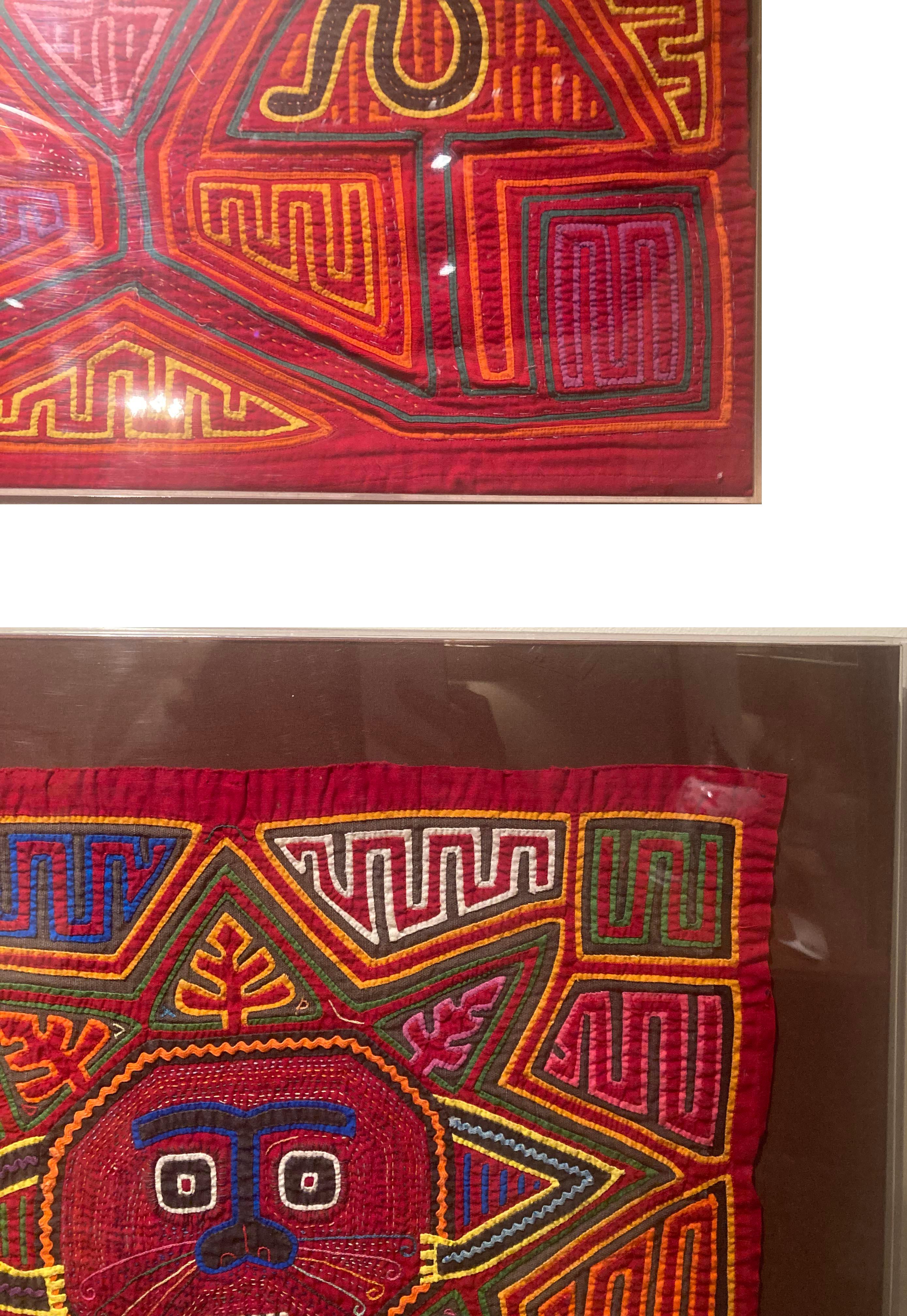 Set of six hand-sewn Mola reverse appliqué textiles framed in plexiglass cases and mounted on brown cotton fabric. These are in great condition with little to no damage or color discoloration of the fabric. Wonderful, vibrant colors.
