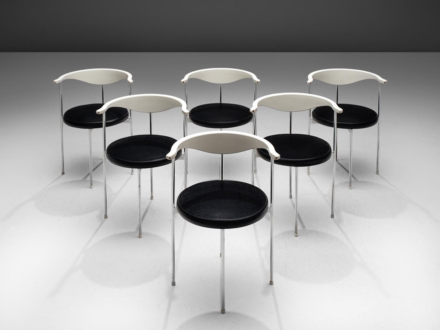 Frederik Sieck, six chairs, black skai, metal, white wood, Denmark, design 1962, execution 1967.

These industrial clear set of the model 3200 chairs were designed by the Swedish Frederik Sieck for Fritz Hansen. The round chair has a classic