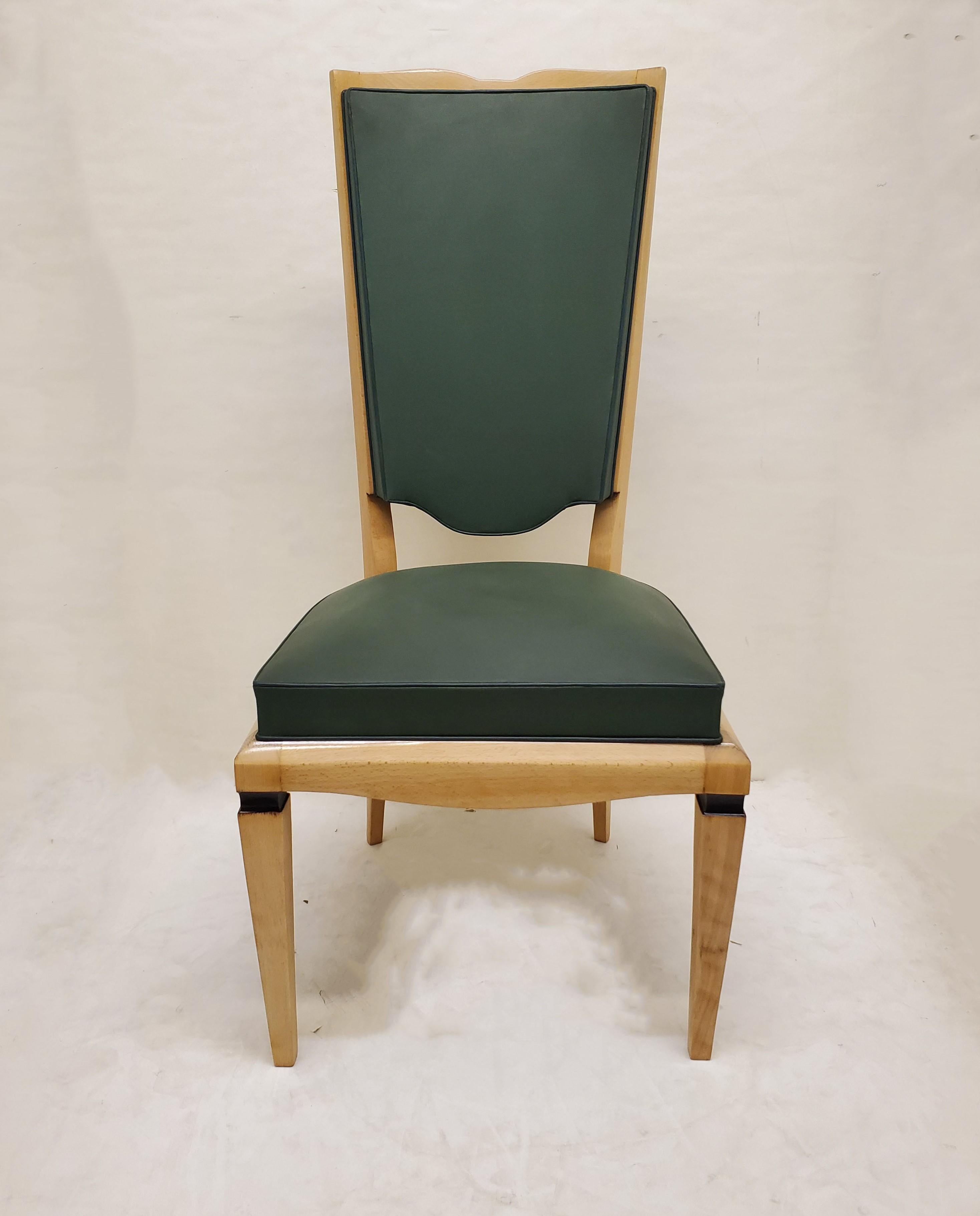 A beautiful set of six original French Art Deco tall back blonde wood dining chairs attributed to Maurice Jallot.
Tall elegant backs with curvilinear top crest and shield shape lower backrest, featuring elegant tapered tubular front legs and