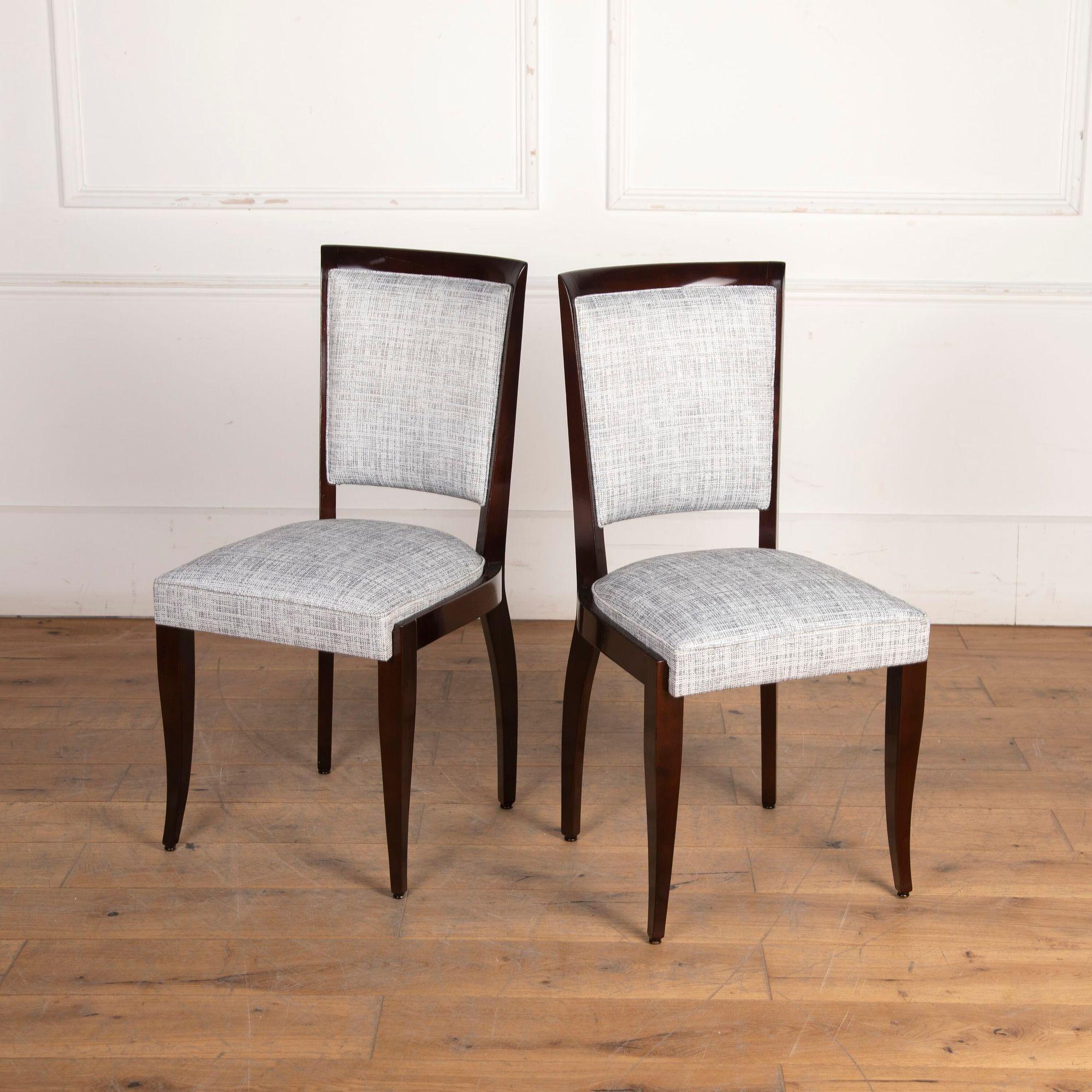 Chic set of six French Art Deco dining chairs. 
Each chair is covered with grey melange colour upholstery and is in a great, stable condition. 
Would suit all interior settings!