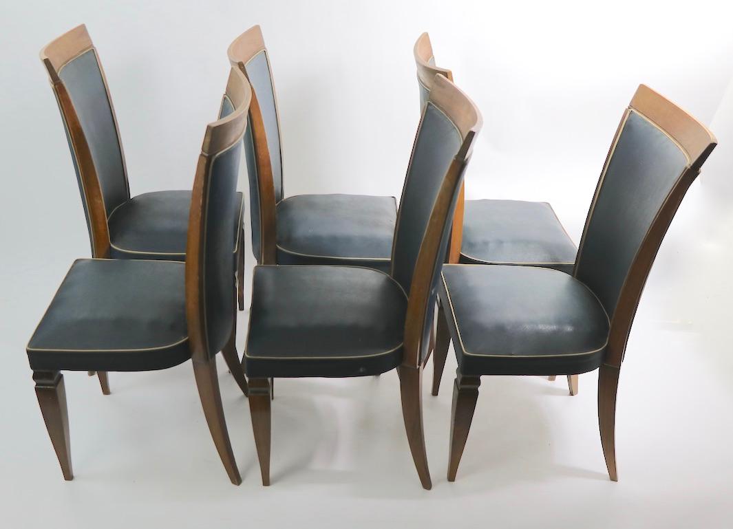 Nice set of 6 French Art Deco high back dining chairs, attributed to Gaston Poisson. This set is in good original condition, usable as is or you can restore to perfection if you want a more polished look. Frames are sturdy, and solid, wood shows