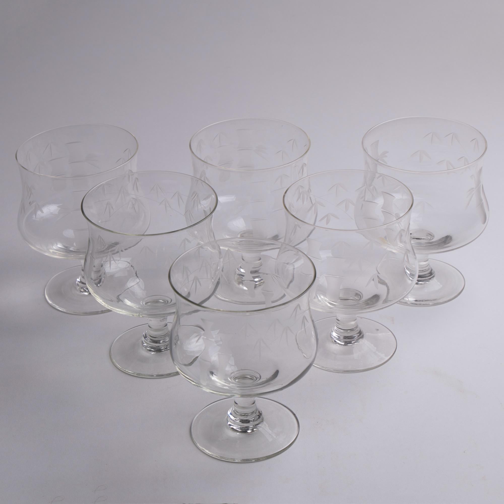Set of six Art Deco wine glasses, French, circa 1930
Measures: H 12cm, W 9.5cm
Etched bamboo design to bowl.