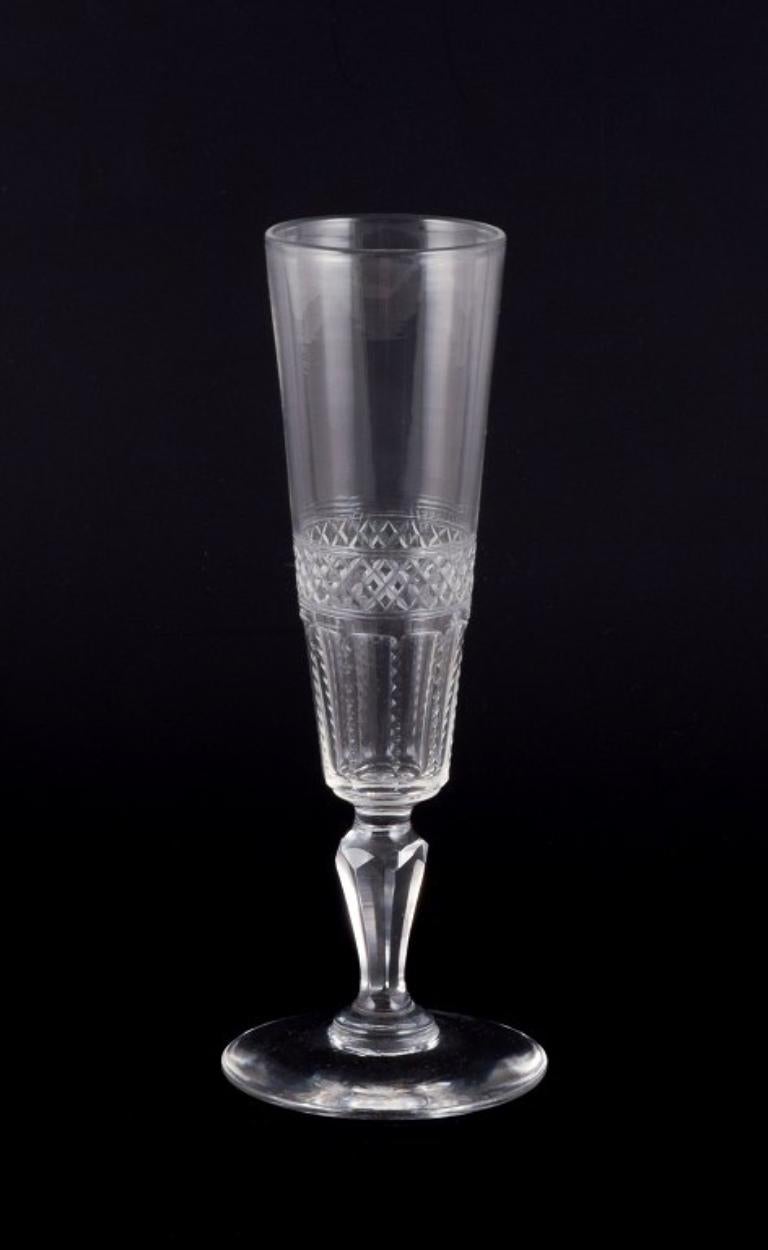 A set of six mouth-blown French champagne flutes in crystal glass. Faceted cut. Handmade. 
Circa 1900. 
Perfect condition. 
Dimensions: H 17.5 cm x D 6.7 cm.