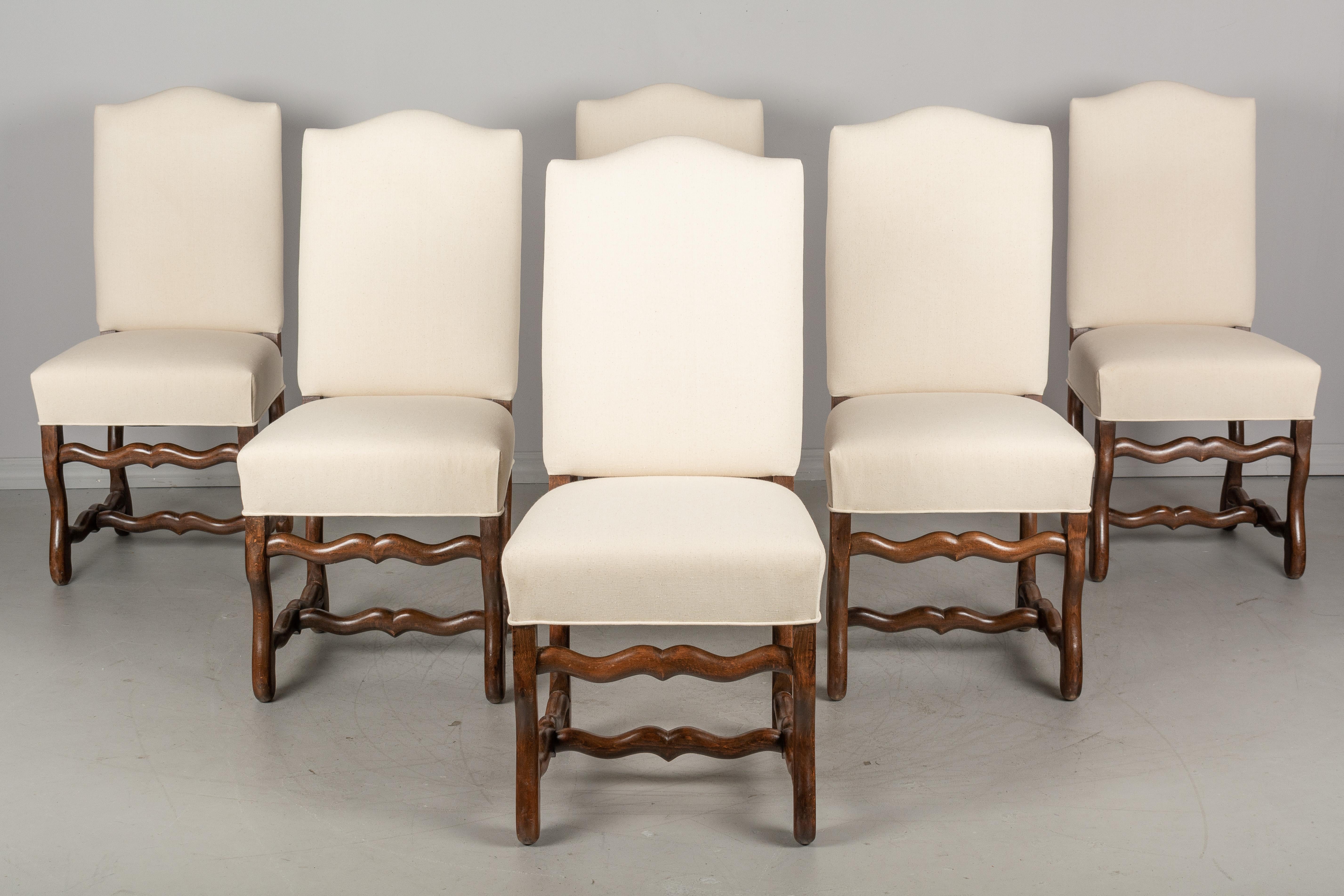 A set of six French dining chairs made of beechwood and upholstered in neutral canvas fabric. Sturdy with comfortable seating. Please refer to photos for more details. We have a large selection of French antiques.

  