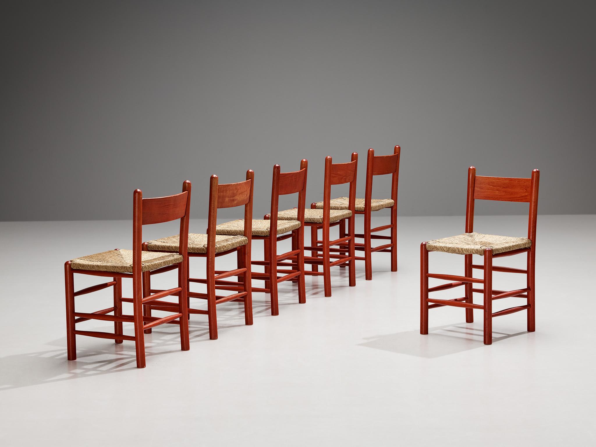 Set of six dining chairs, beech, straw, France, 1960s.

Stunning set of French chairs with red beech frames and classic organic straw seats. This set of six dining chairs features a solid wooden frame, consisting of cylindrical thick legs that are