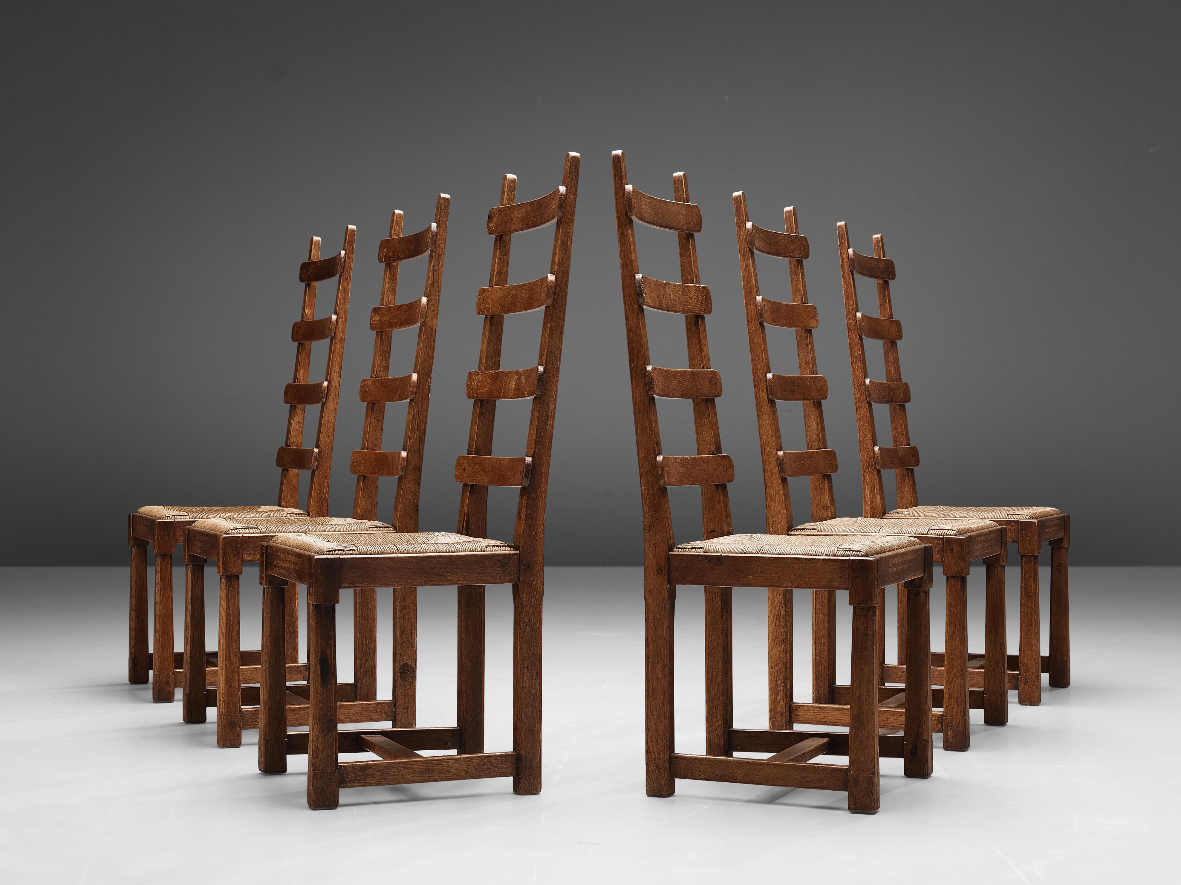 Set of six dining chairs, rush, oak, France, 1950s

French dining chairs in oak and rush seats. Characteristic about these chairs is their impressive high backrest structured with four horizontal slats. The front legs are carved in a sculptural