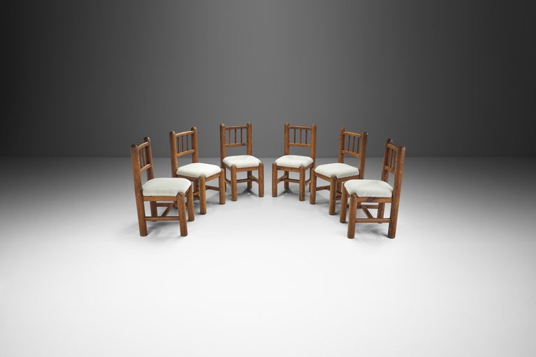Wood, in many ways, is more valuable than other materials used in furniture manufacturing because its natural grain guarantees that each piece is unique. This is especially important in the case of this set of six, as each chair is unique but
