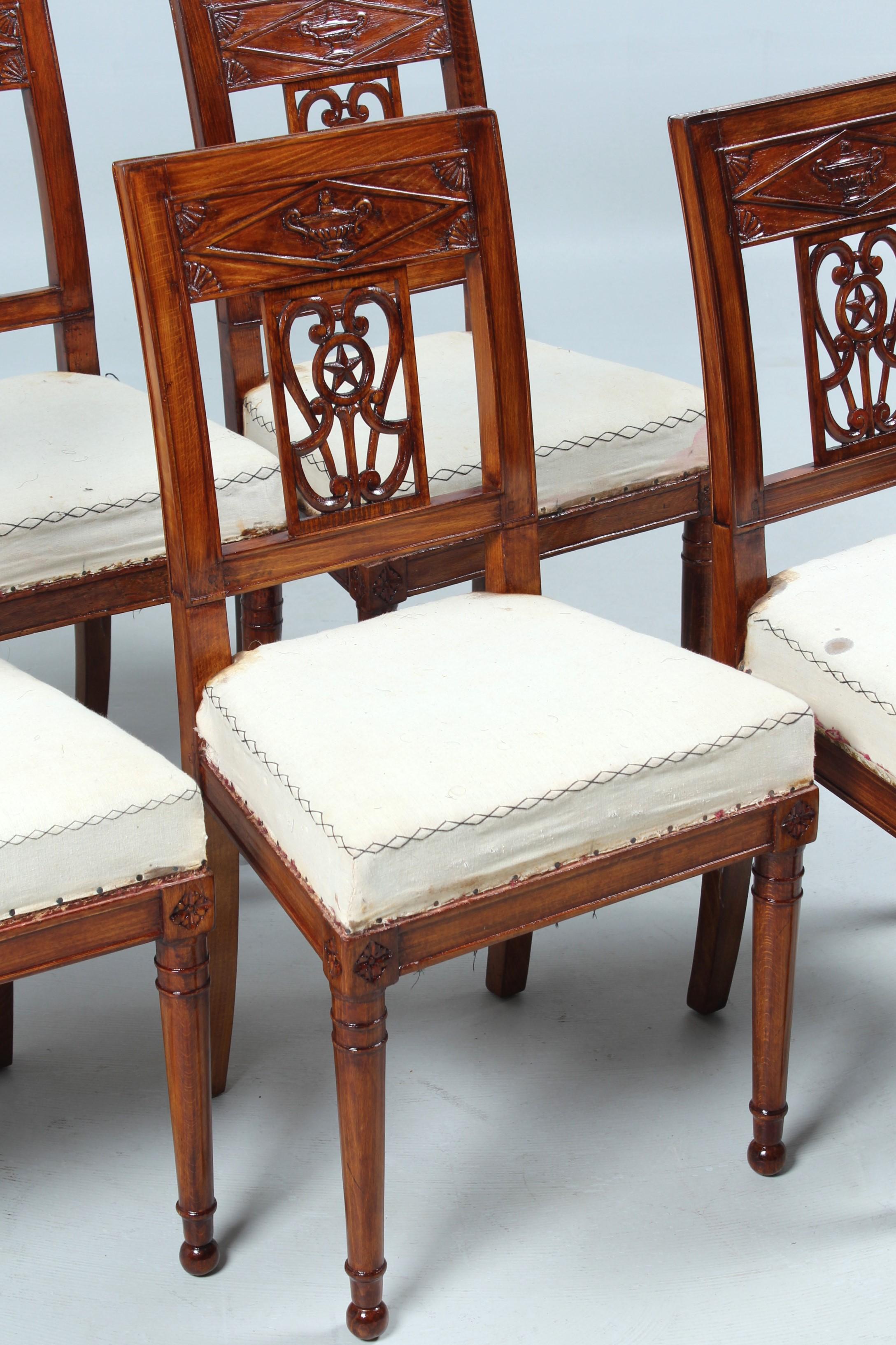 Six identical antique chairs

France
Beech
Directoire around 1800

Dimensions: H x W x D: 87 x 45 x 41 cm, seat height: 46 cm

Description:
Beautiful set of provincial French chairs with typical Directoire decoration.
The round legs at the front end