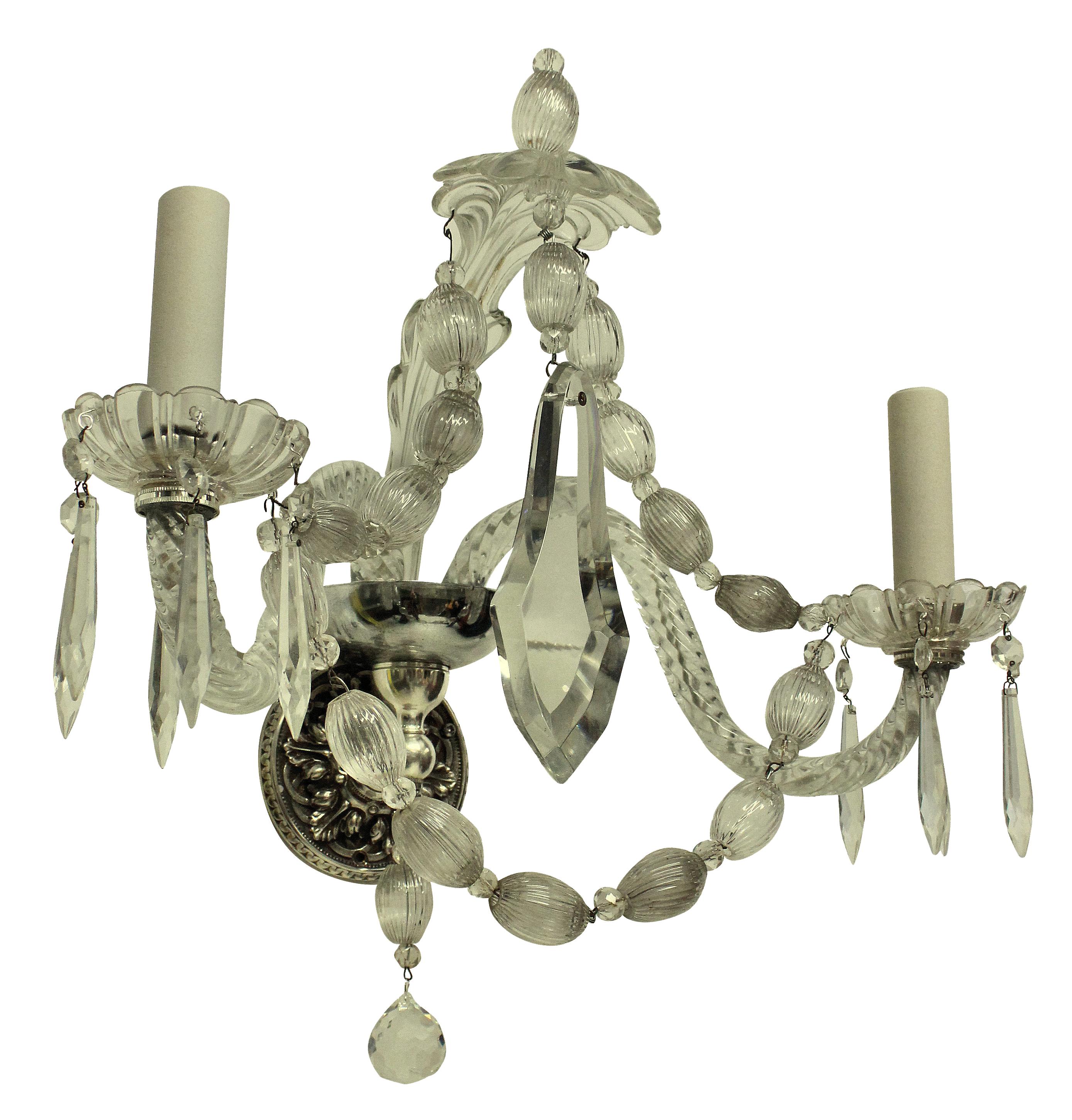 A set of six twin branch French wall sconces in cut and moulded glass.