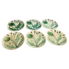 Juego de seis platos de espárragos/alcachofas de porcelana mayólica francesa