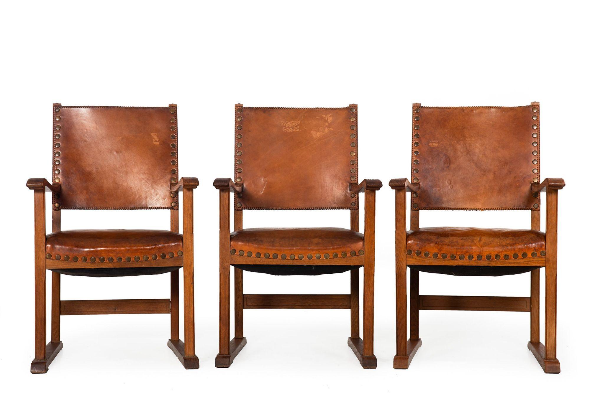 SET OF SIX FRENCH OAK AND COGNAC STITCHED-AND-STUDDED LEATHER DINING CHAIRS
Circa early 20th century
Item # 308ZOG16A 

A rich and wonderful set of six dining chairs, they feature wonderful solid oak frames with heavy patinated leather upholstery.