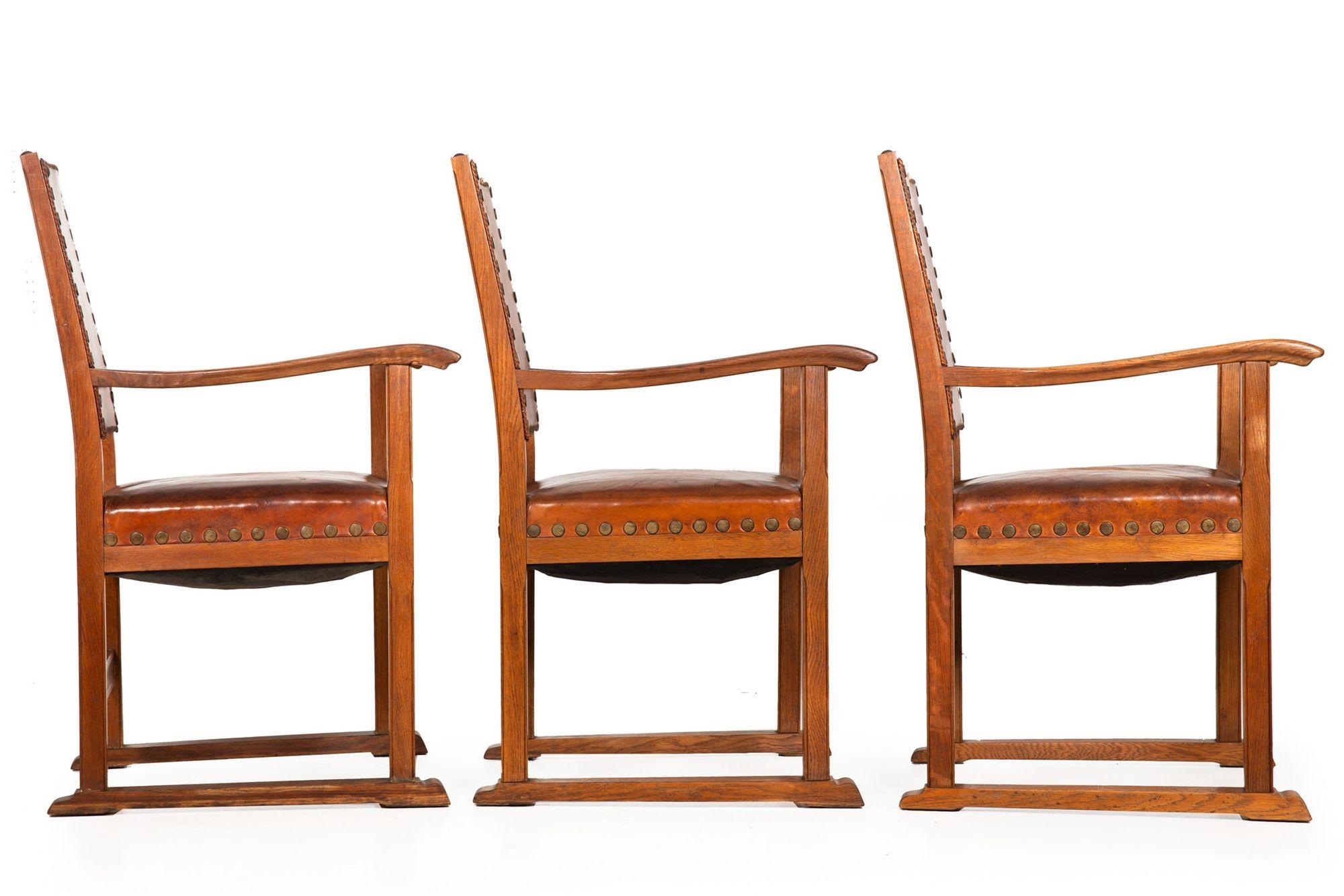 Brass Set of Six French Oak and Stitched Leather Chairs For Sale