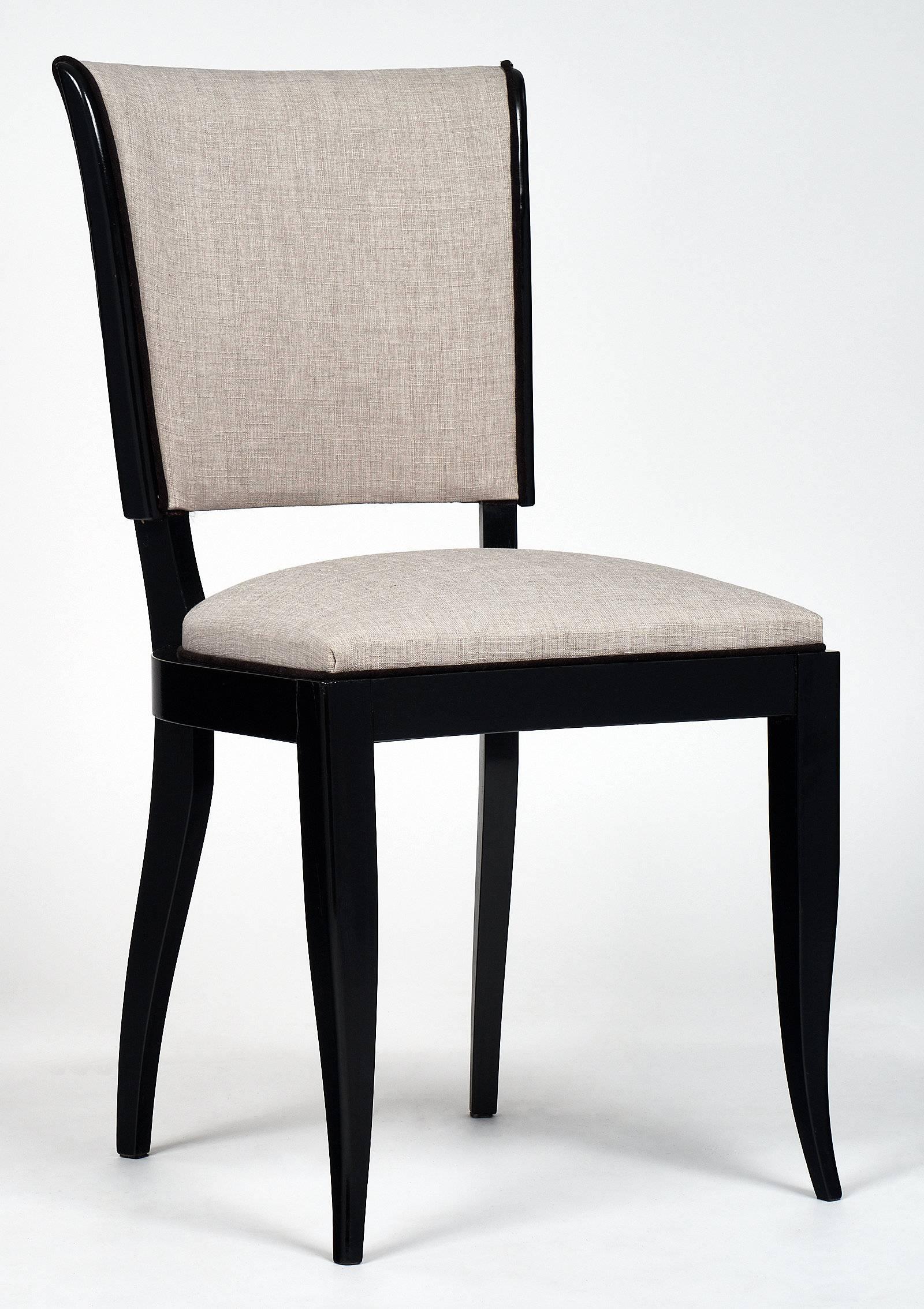 French set of six vintage Art Deco dining chairs of cherrywood, ebonized and finished with a lustrous French polish. Newly upholstered with a grey linen blend fabric and a black velvet double cording. We loved the strong, comfortable structure, the