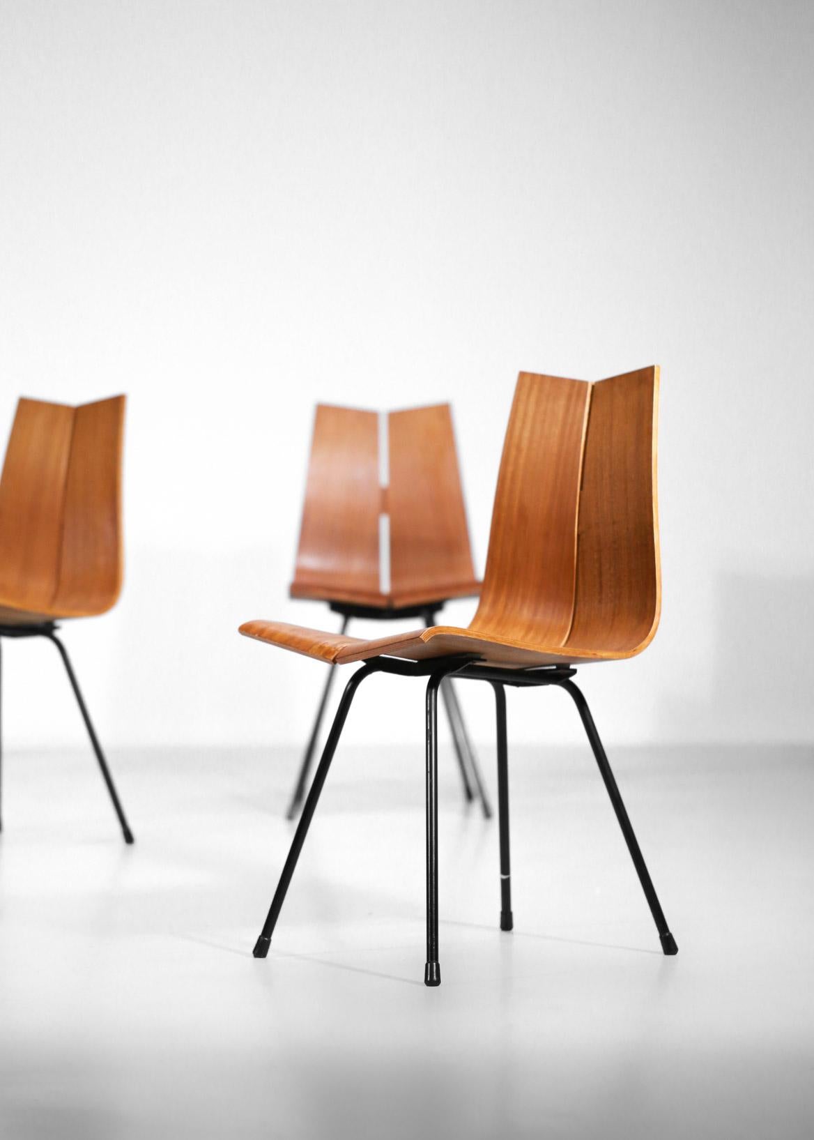 Set of six GA chairs designed by Swiss designer Hans Bellmann in the 1950s for Horgen Glarus.
Black lacquered tubular steel legs and thermoformed plywood seats. 
Fully restored, some veneer grafts (see on the pictures).
