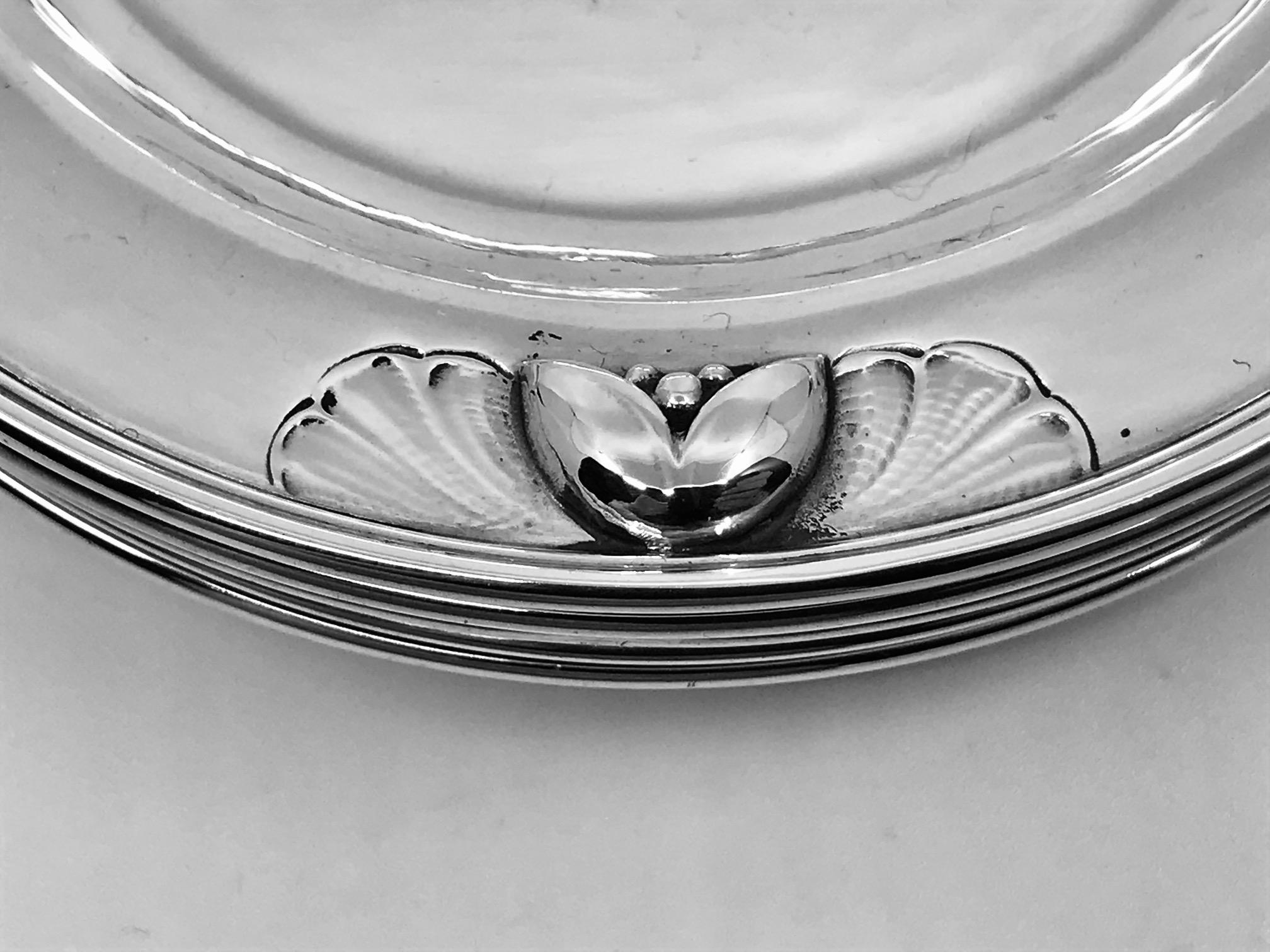 This is a set of six sterling silver Georg Jensen butter plates, design #428A by Georg Jensen.
Measure 4? (10cm) in diameter.
All with matching vintage Georg Jensen hallmarks from the 1930s.
