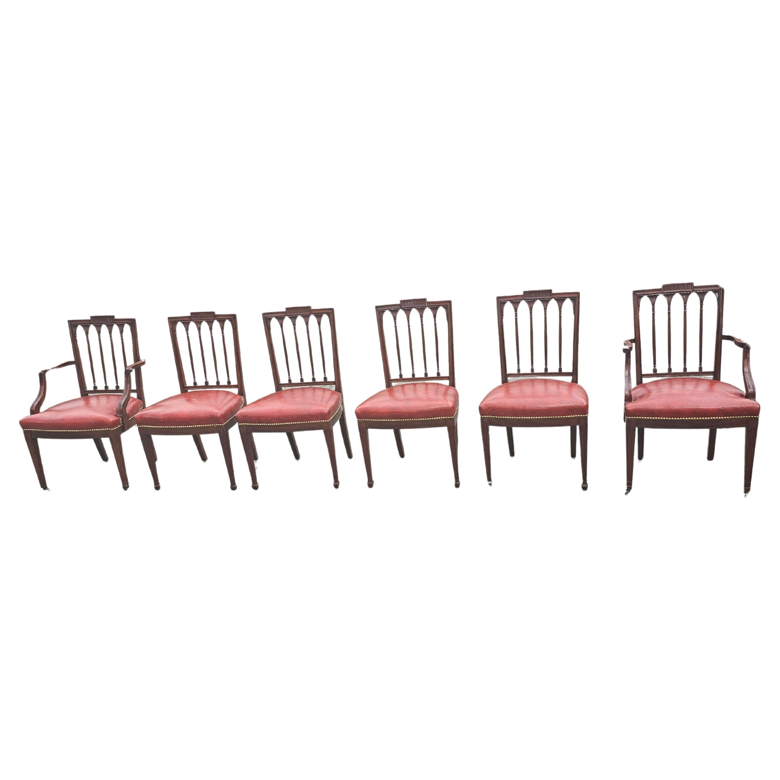 A Set Of Six George III Style Mahogany Leather Upholstered  seat Dining Chairs. Fine carvings on back. Nail gead trims. Very good vintage condition. No cracks on leather seat. Measures 22