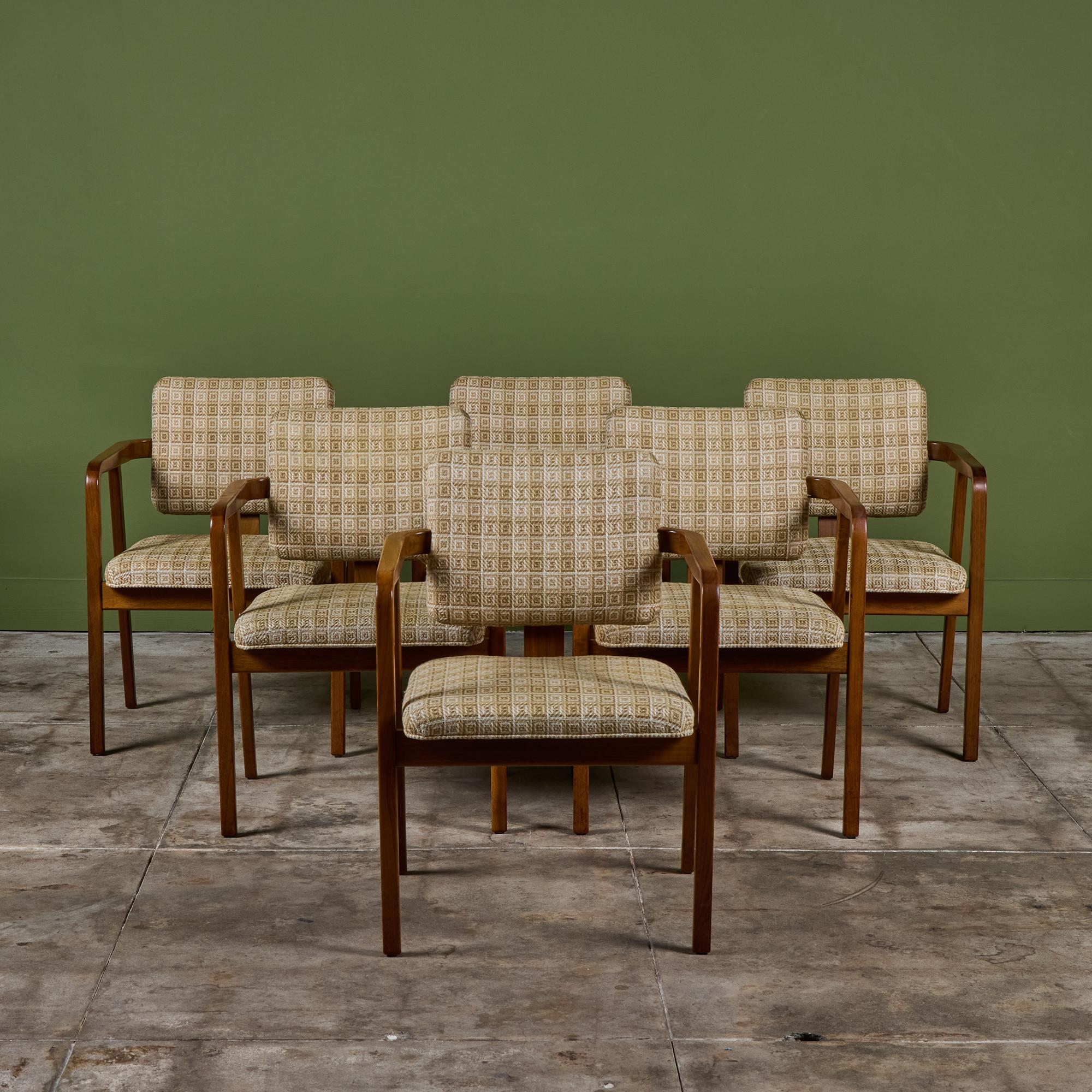 Set of six George Nelson upholstered dining armchairs for Herman Miller, model #4663. The chairs feature geometric woven fabric seat and seat back. The walnut frame showcases curved armrests and splayed legs.

Dimensions
23