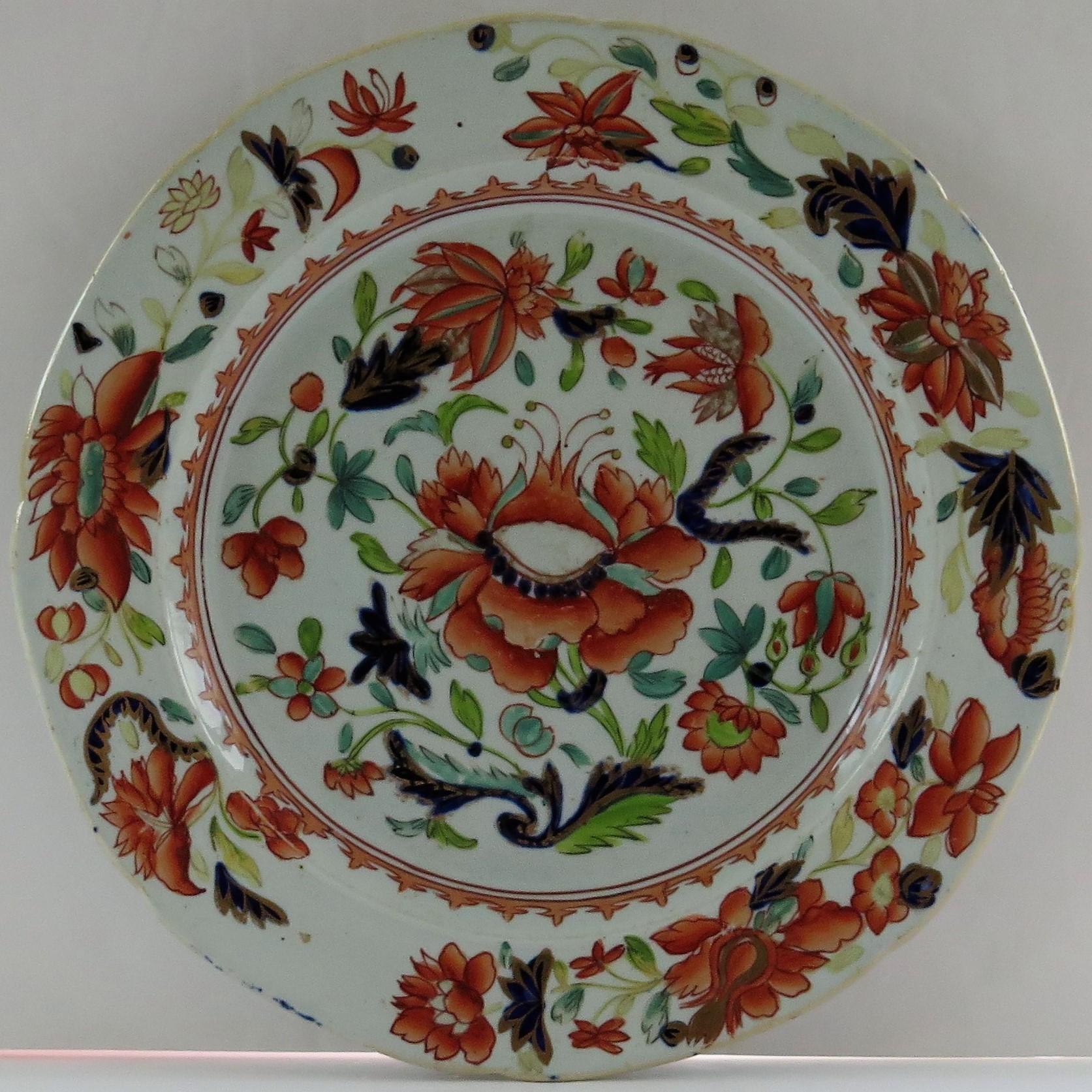This is a rare set of six early dinner plates, all hand painted in the large stamen flower pattern, made by Mason's Ironstone, Lane Delph, England and dating to circa 1813-1820.

The plates have a circular shape, with a slightly indented rim and