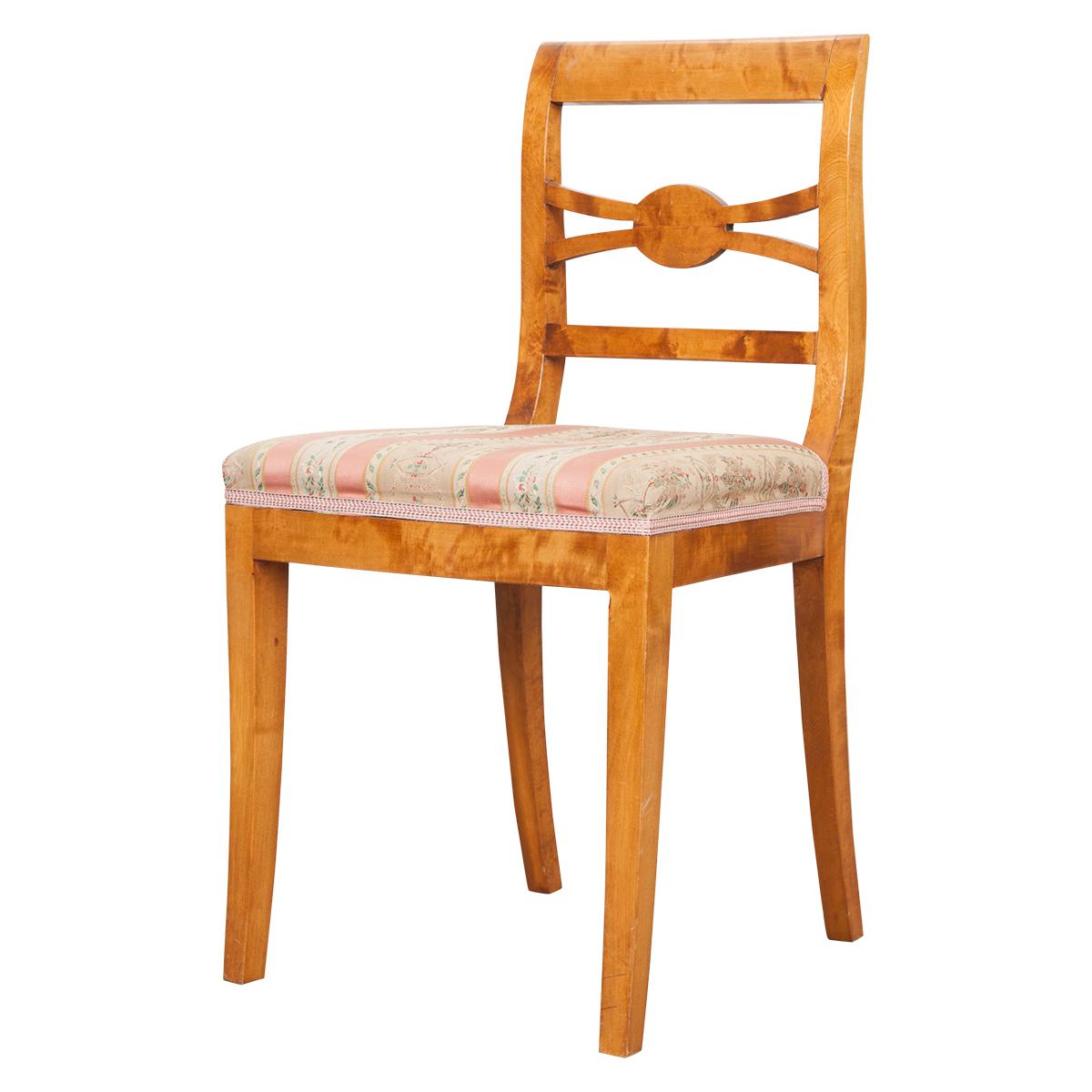 This gorgeous set of six Biedermeier side chairs, circa 1830, are from Germany and retain their original floral striped upholstery. They feature gently sloping lines and geometric chair backs typical of the style. Diminutive in stature, these dining