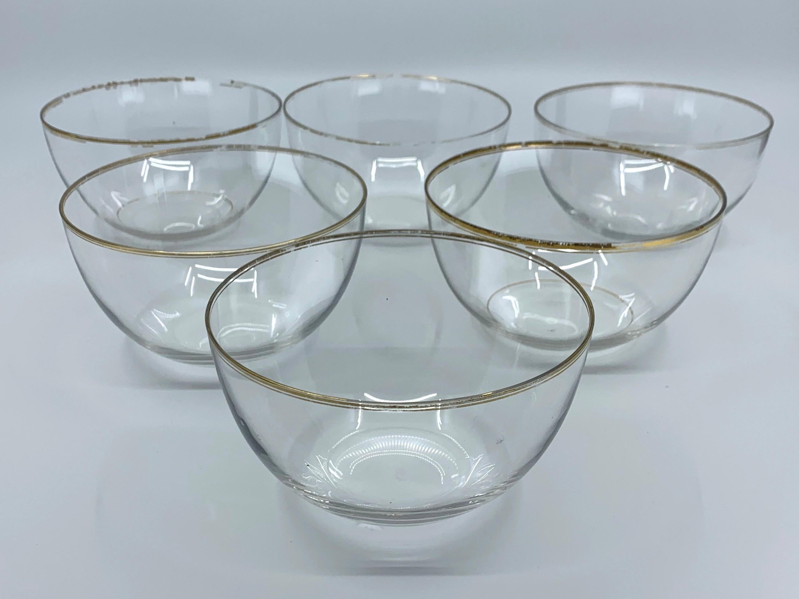 Set of six glass bowls with gilt rim. Six antique gilt-rimmed finger bowls/ice cream bowls/floating rose bowls to set at table. France, circa 1920s.
Diameter: 4.5