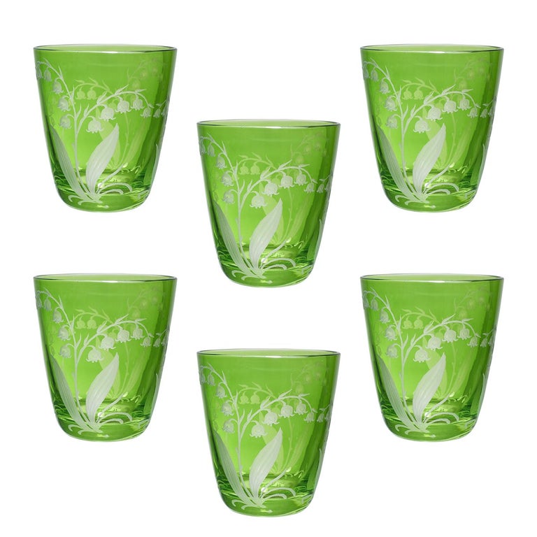 Set of 6 hand blown tumblers in green crystal with a country style lily of the valley decor all around. A matching carafe can be ordered in addition. Can be ordered in different colors like blue, pink and green. Not recommend for dishwasher