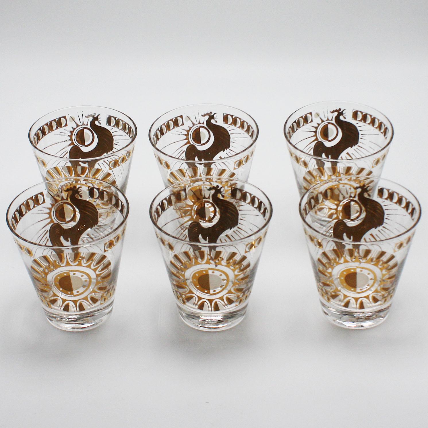Set of six gold rooster and sunburst glasses by Fred Press, circa 1960.
$625.