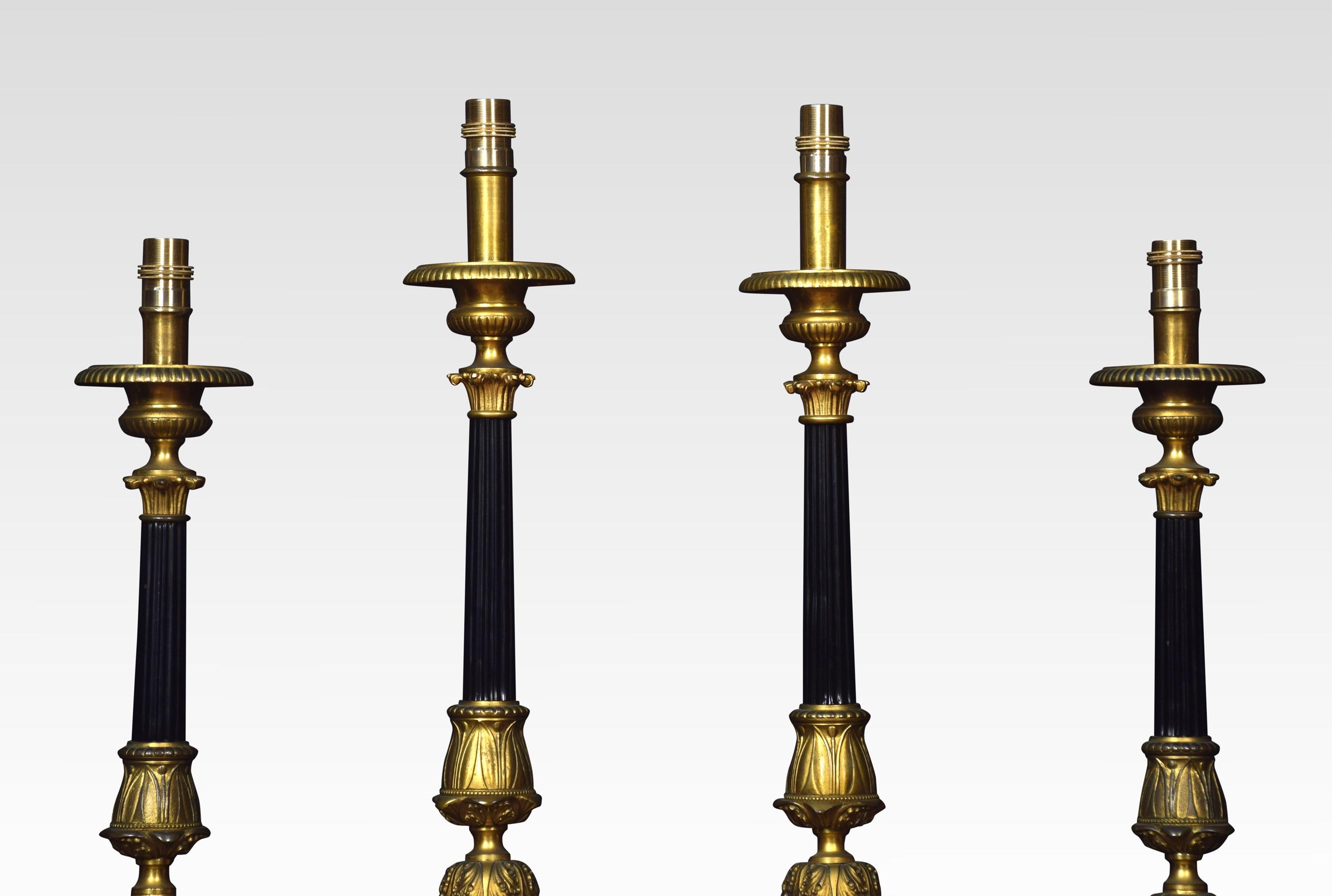 Set of six matched graduated ecclesiastical table lamps. Having circular drip pans to the ebonized reeded columns. Raised up on acanthus capped triform bases with cherubic heads and paw feet.
Dimensions:
Large
Height 23.5 inches
Width 6