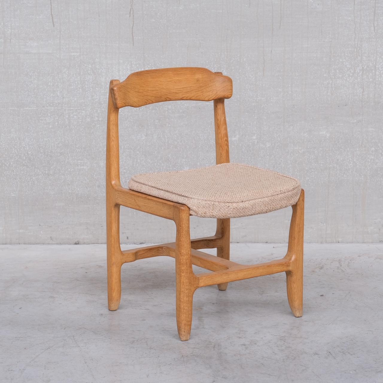 A set of six oak French dining chairs by esteemed designers Guillerme et Chambron. 

France, c1960s. 

Oak and upholstery. 

Original upholstery remains, it is functional and usable but could do with updating. 

Some scuffs and wear commensurate