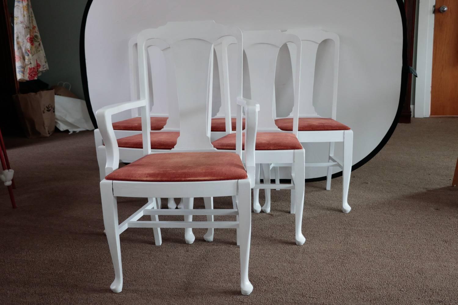 Set of six hale dining chairs 1900s painted high gloss white. Stamped on the bottom. Relatively newly upholstered. Fine condition. Well made.

One King armchair - back in the day only the man would get an armchair.
Queen head of the table and