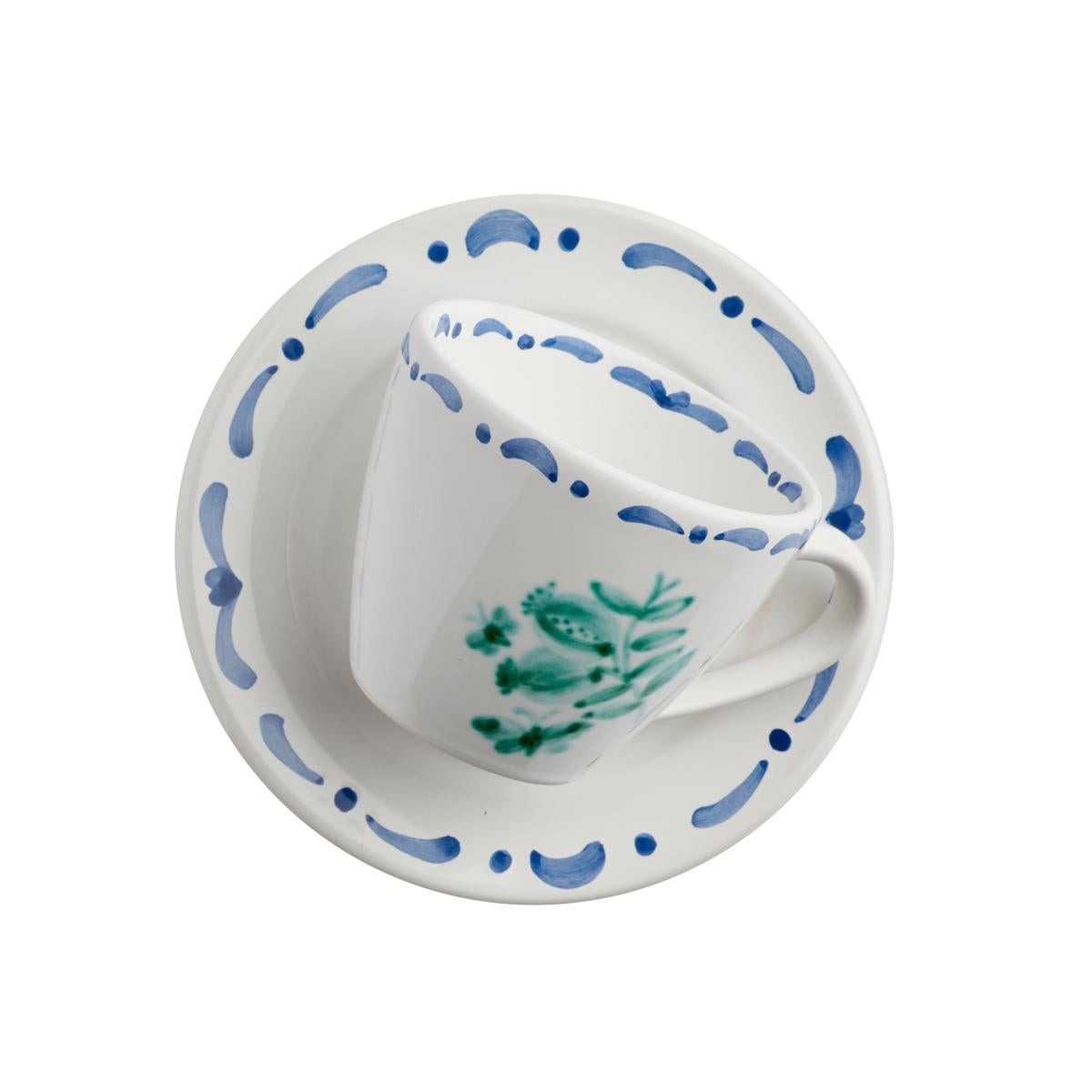 Set of six hands-free painted ceramic cups with saucers. Decorated with a handpainted green pomegranate decor in the center and a hands-free painted garlande in blue. The garlande can be ordered in different colors. Produced in Austria in the