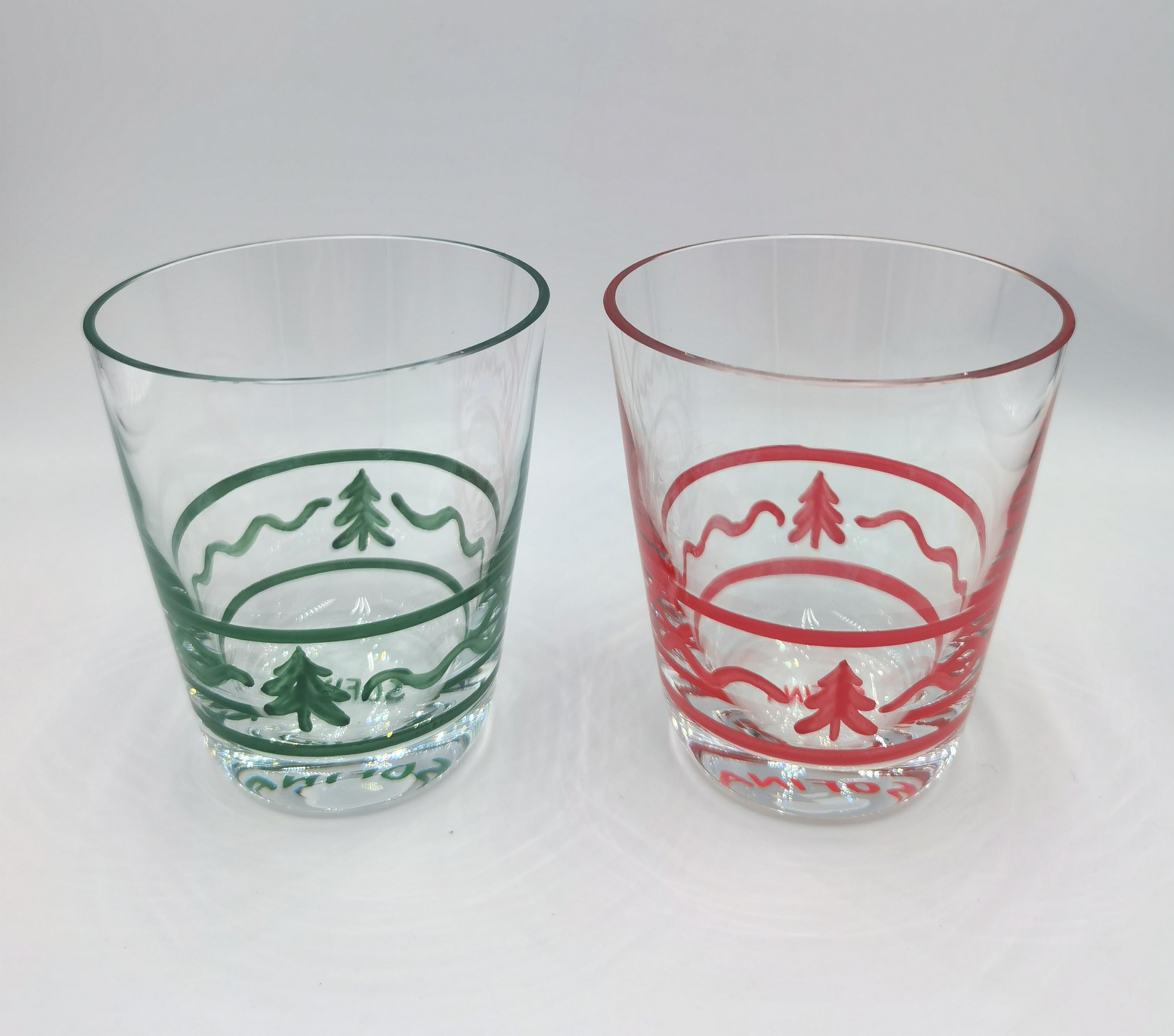 Set of six hand blown tumbler hands-free painted in Black Forest style. Each glass is handsfree painted with different rims and trees in red. Can be ordered in mixed colors green red or in one color. A matching carafe can be ordered in addition.