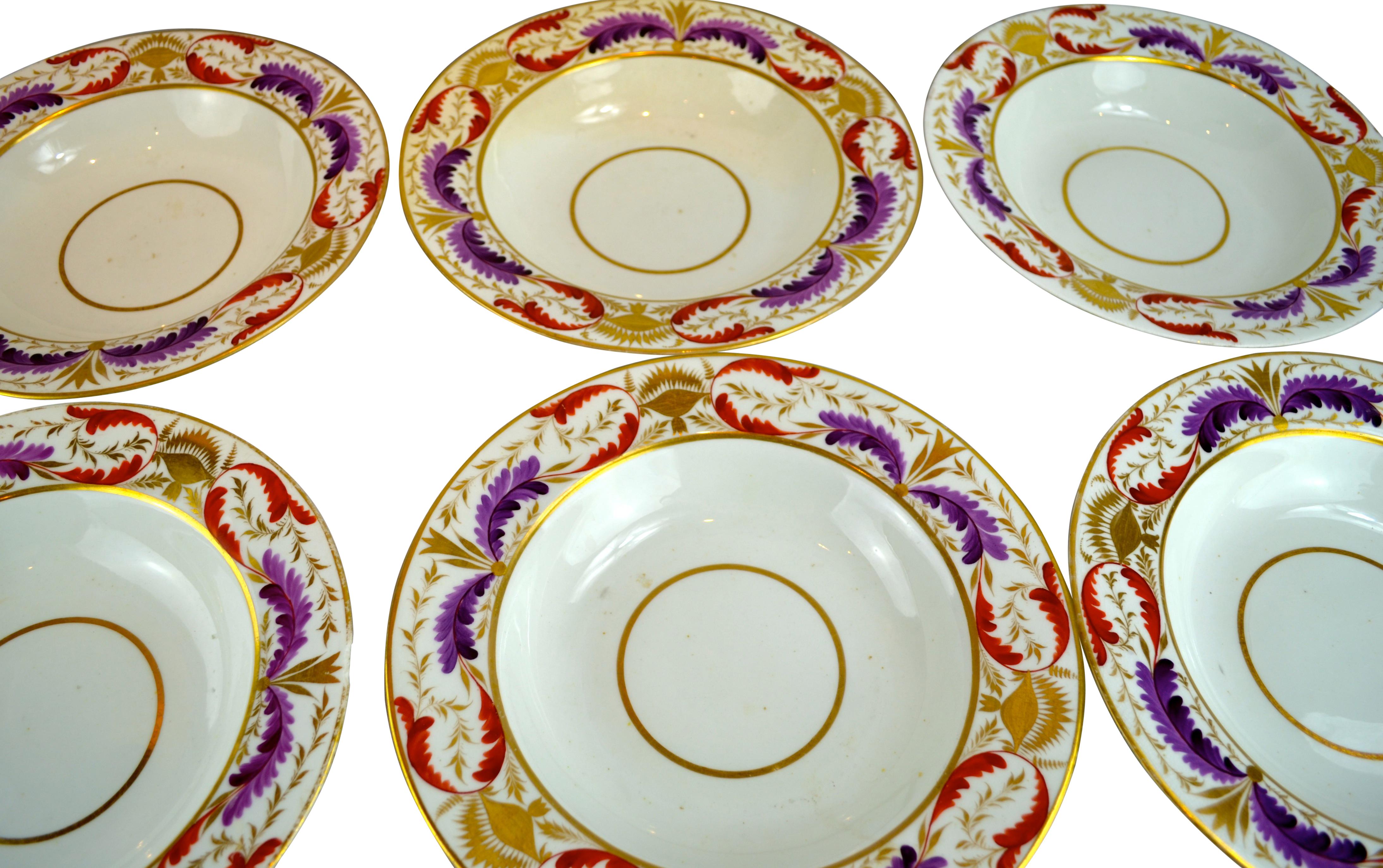 The plates with borders decorated in purple, coral and gold feathering; all stamped with red Worcester mark; three of them have the number D44 stamped under the mark, the other three do not, England, circa 1810. Except for an easily reparable chip