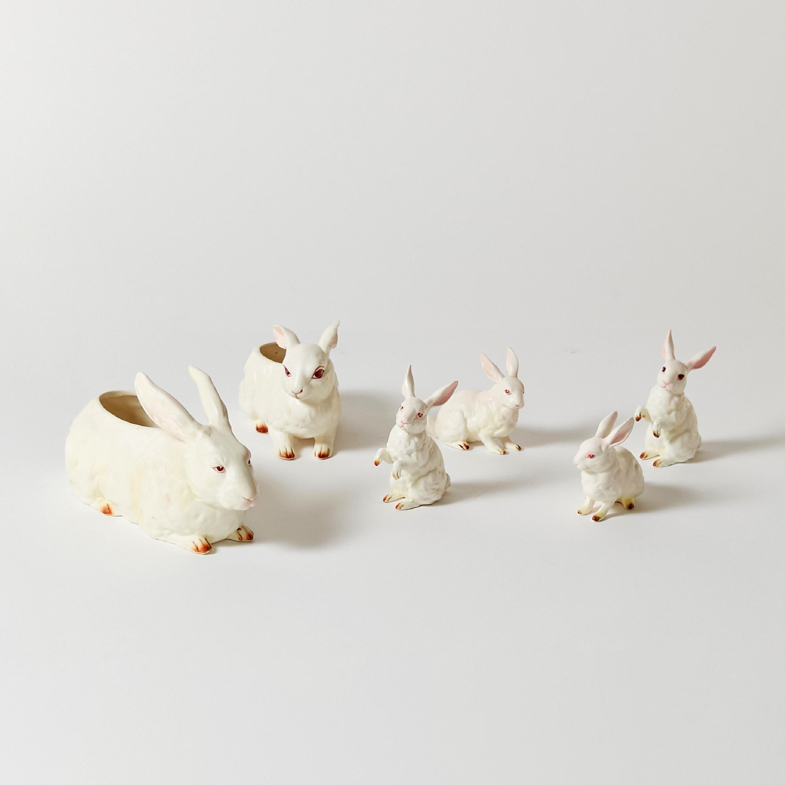 Set of ten hand painted porcelain Lefton bunnies in different sizes. The biggest bunnies are hollow, and work as a shallow vase or candy bowl.
These pieces were made in Japan in 1960.
Range of dimensions
Big bunny
Height 5.5 in / 13.97 cm
Width