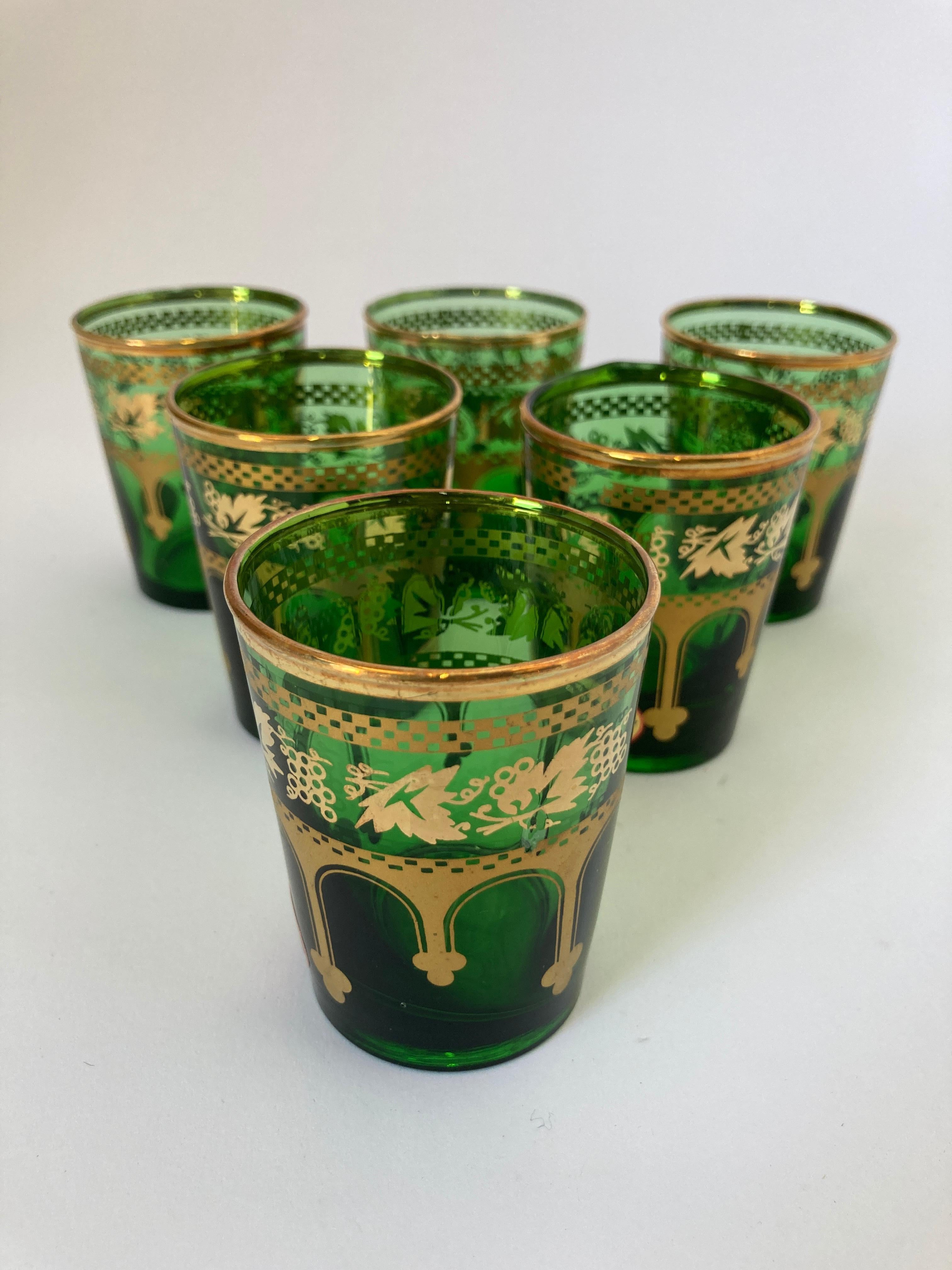 Set of six green and gold handblown Moorish Moroccan glasses.
Use them for Moroccan tea, or any hot or cold drink.
Shot glasses very light finely decorated with a classical gold Moorish pattern frieze.
Use these elegant glasses for Moroccan tea, or