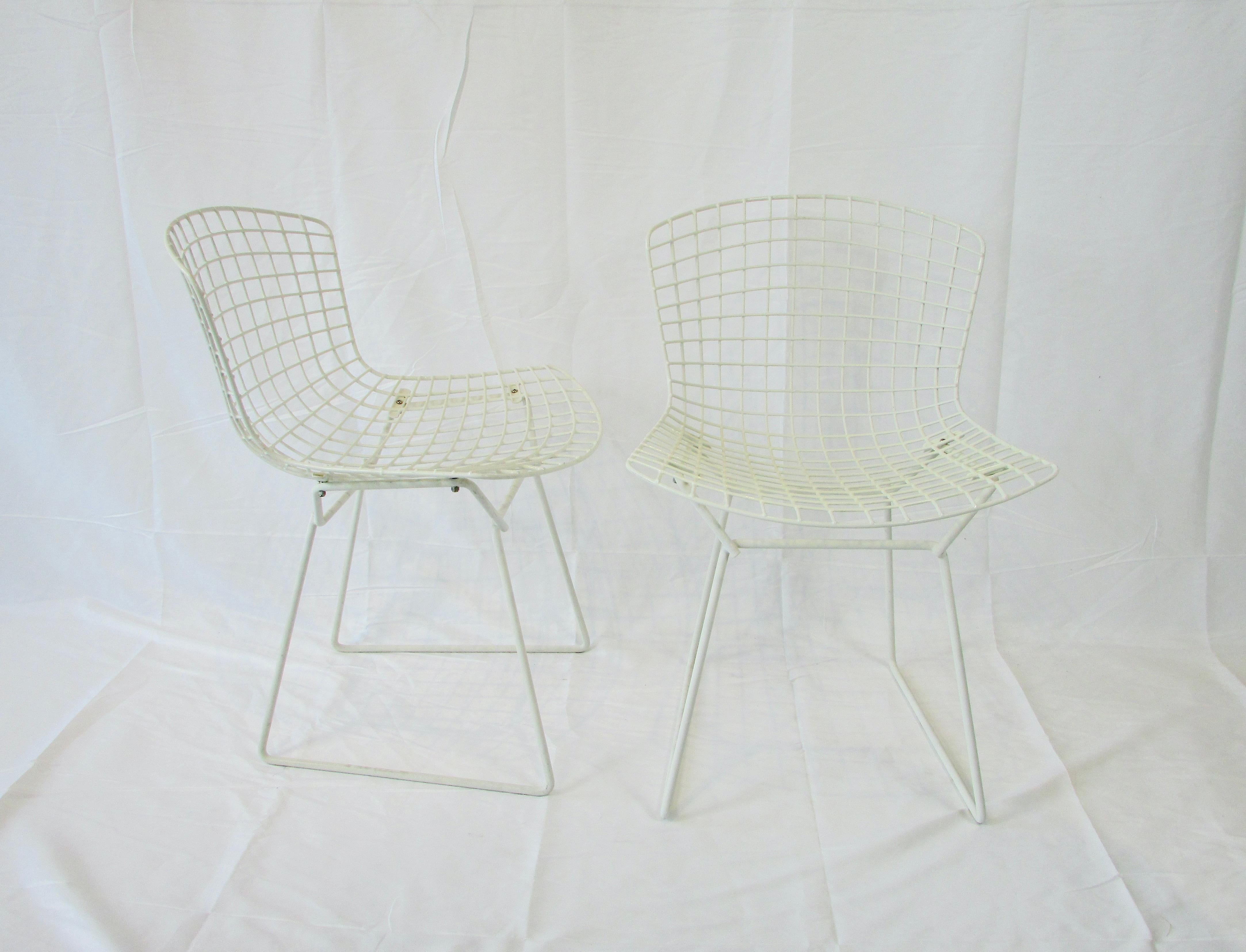 Set of six white plastic coated dining chairs. Designed by Harry Bertoia and Produced by Knoll international. Set of six in above average condition. One chair retains Knoll label.
Invited by former Cranbrook classmate Florence Knoll to join her