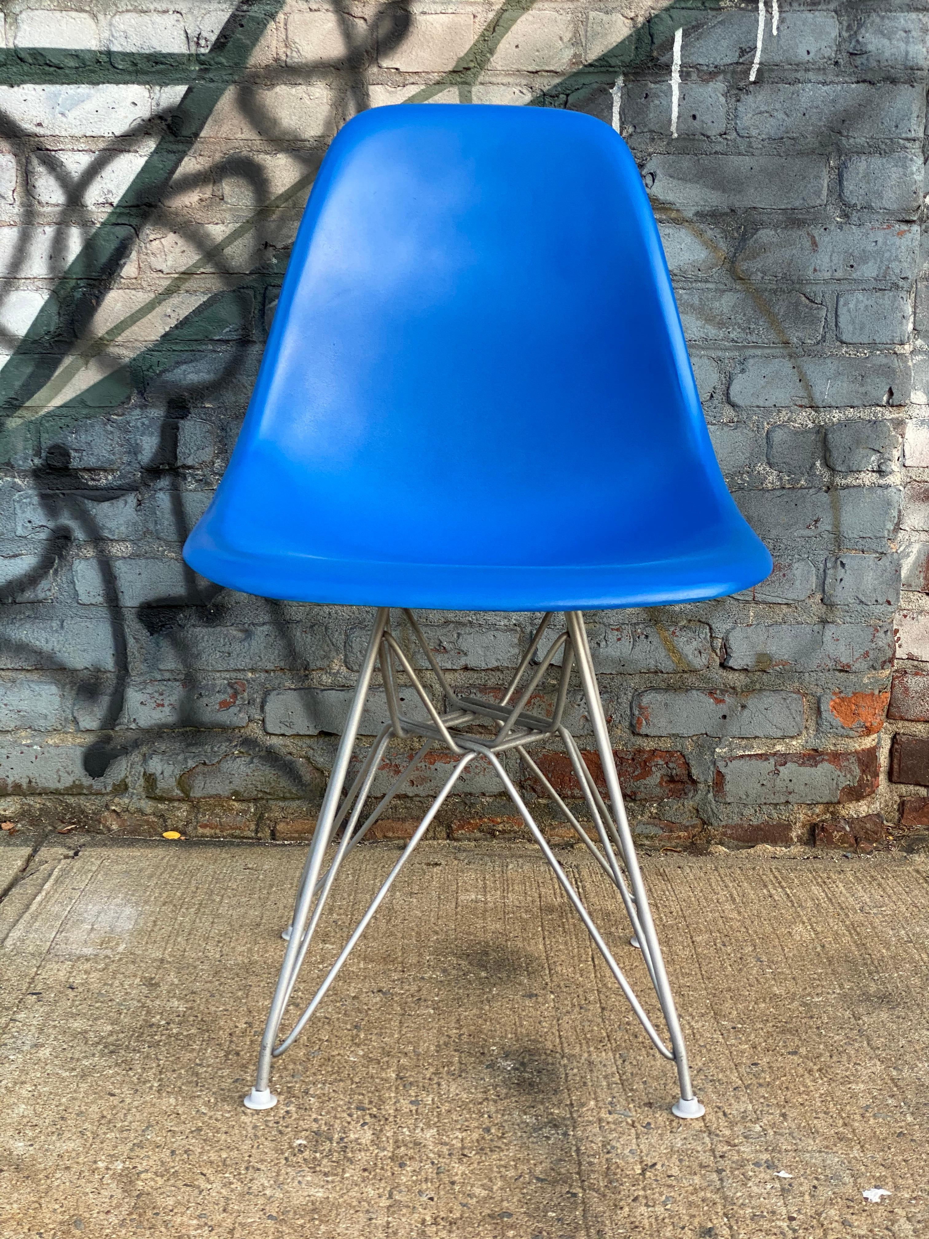 Six vintage Herman Miller Eames fiberglass dining chairs. Chairs in good condition with no cracks. Repainted in beautiful hues and clear coated as well. With modern production Eiffel bases. All glides present and all brand new shock mounts applied