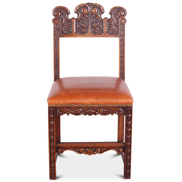 A set of six highly-carved walnut dining chairs with recently-upholstered leather seats. Continental European- Spanish or Italian.