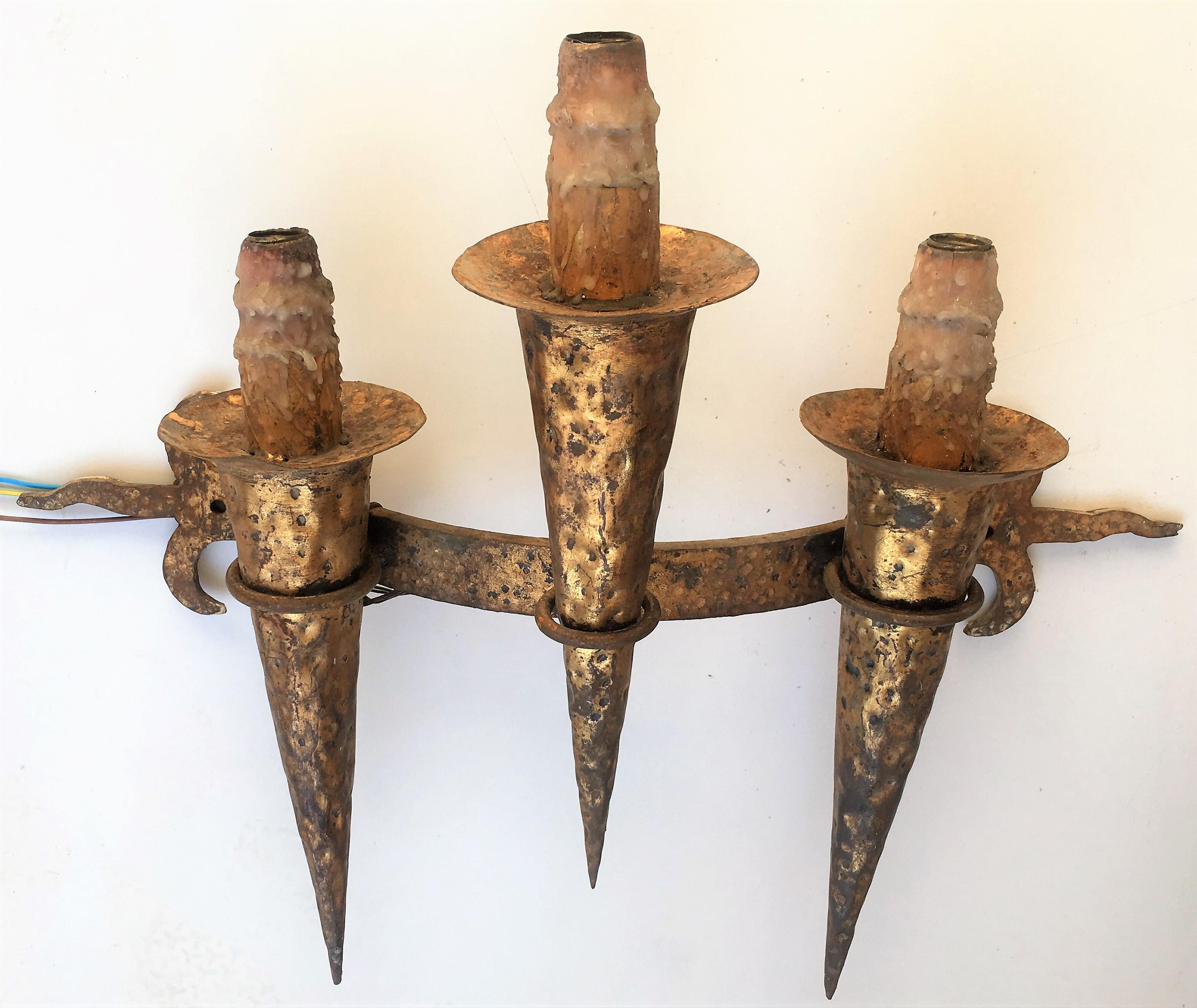 19th century set of six huge Spanish handmade gothic wrought iron and candle torch sconces with three lights each.
   